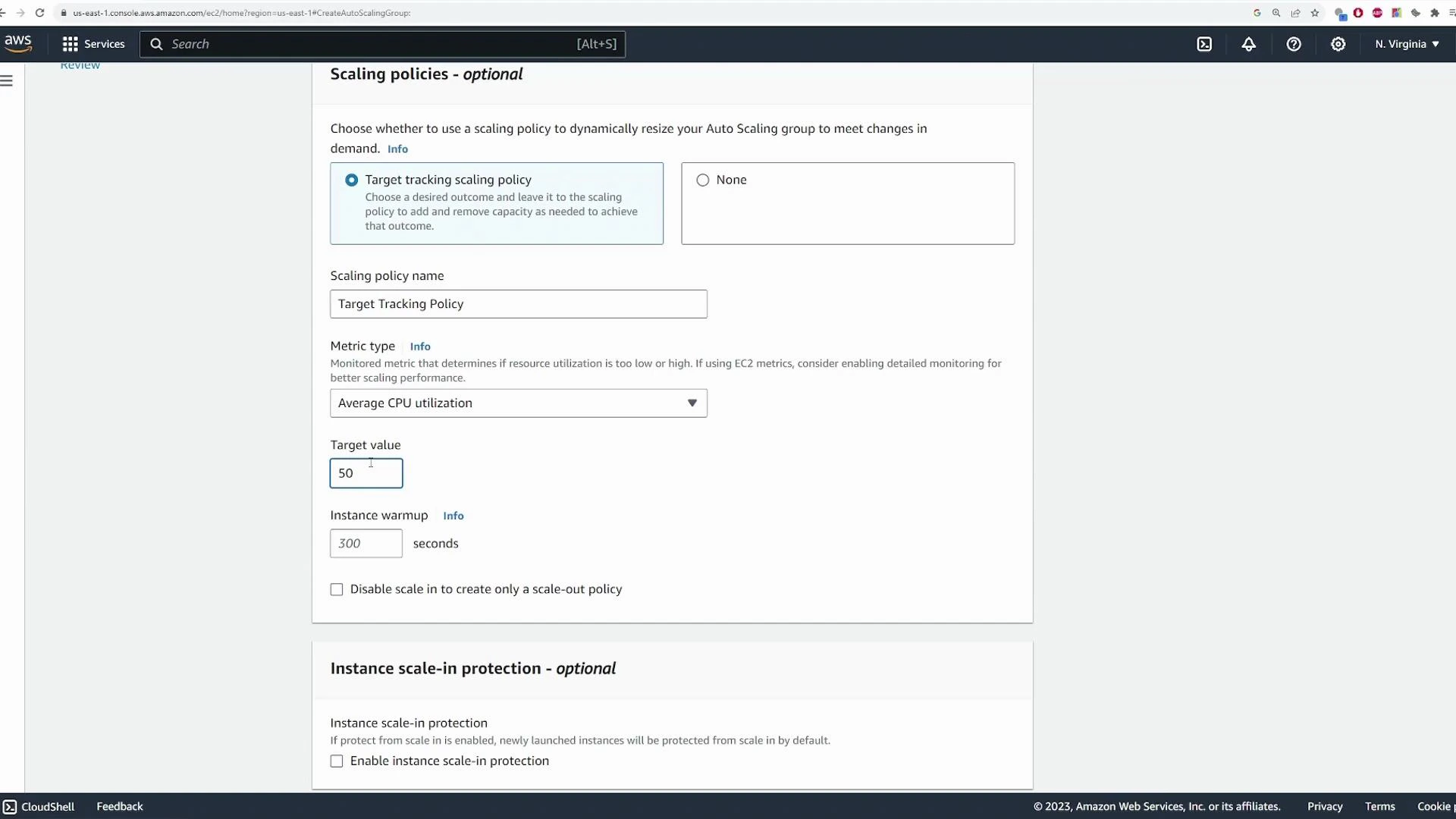 Screenshot of the AWS EC2 Auto Scaling "Scaling policies - optional" settings page. It shows a Target tracking scaling policy configured for Average CPU utilization with a target value of 50 and an instance warmup of 300 seconds.