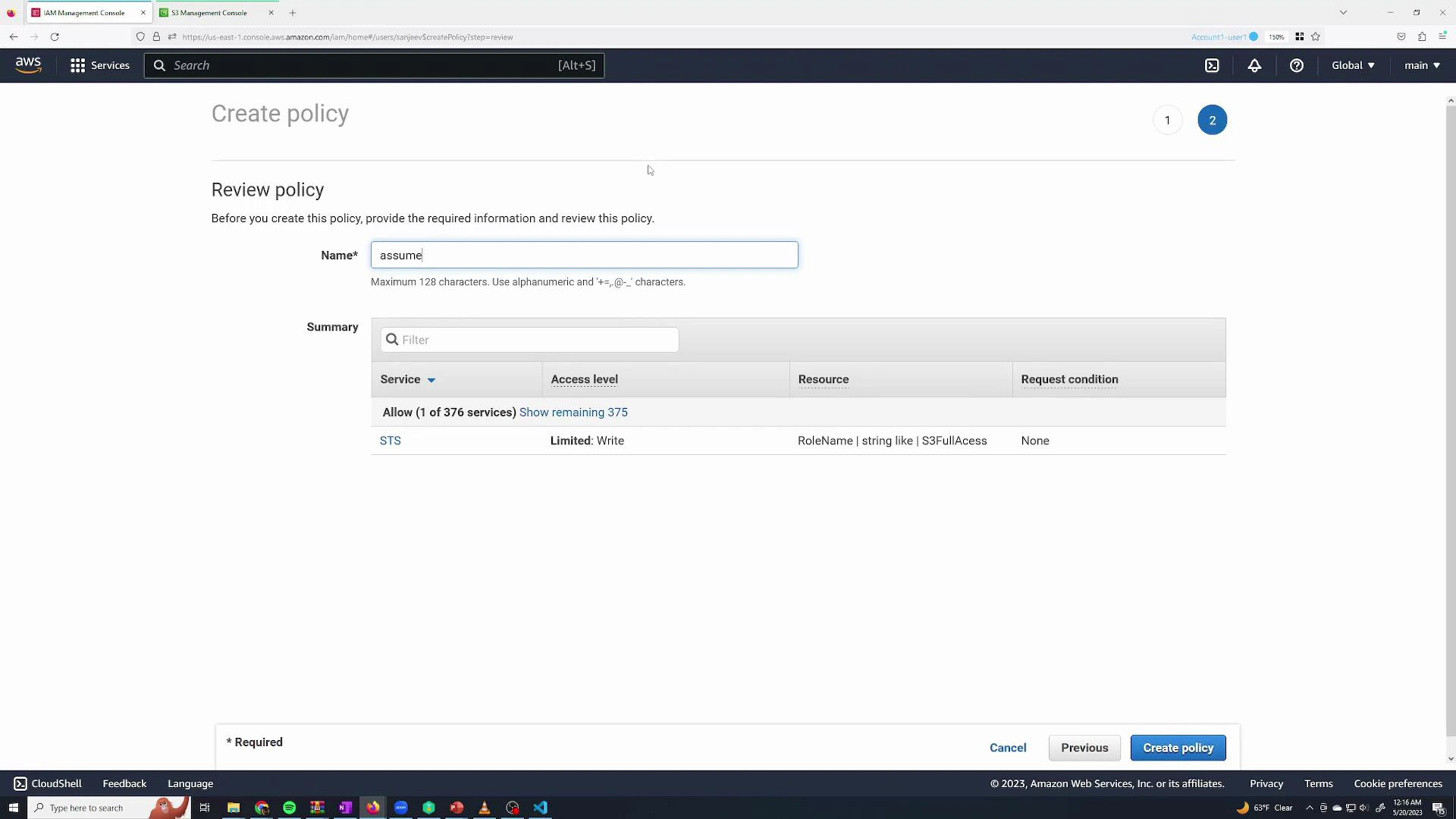 A screenshot of the AWS IAM "Create policy" review page showing a policy name field (filled with "assume") and a summary table listing an STS permission with a resource condition referencing a RoleName like "S3FullAccess." The bottom right shows navigation buttons including "Previous" and "Create policy."
