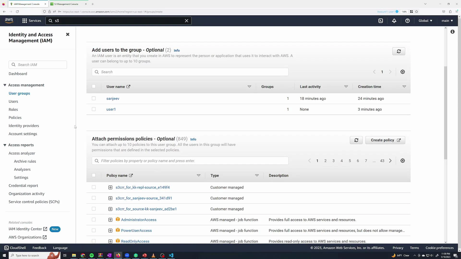 A screenshot of the AWS Identity and Access Management (IAM) console showing the "User groups" page with two users listed ("sanjeev" and "user1") and a section for attaching permission policies. The left sidebar displays IAM navigation items while the main panel shows group membership, last activity, creation time, and available policies.