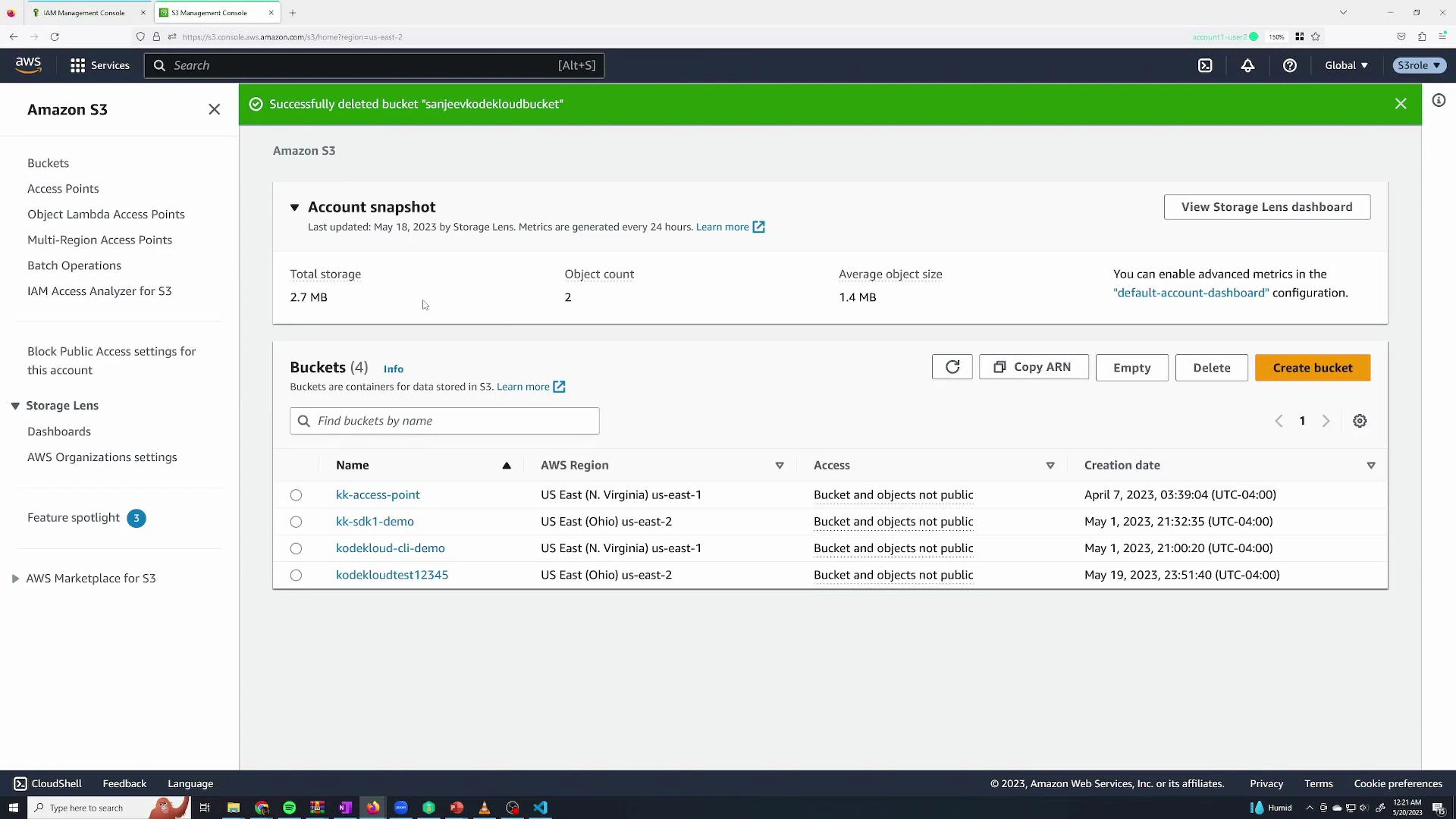 A screenshot of the Amazon S3 Management Console showing an account snapshot and a list of S3 buckets. A green banner at the top announces a bucket was successfully deleted, and bucket names, regions, access settings and creation dates are visible.