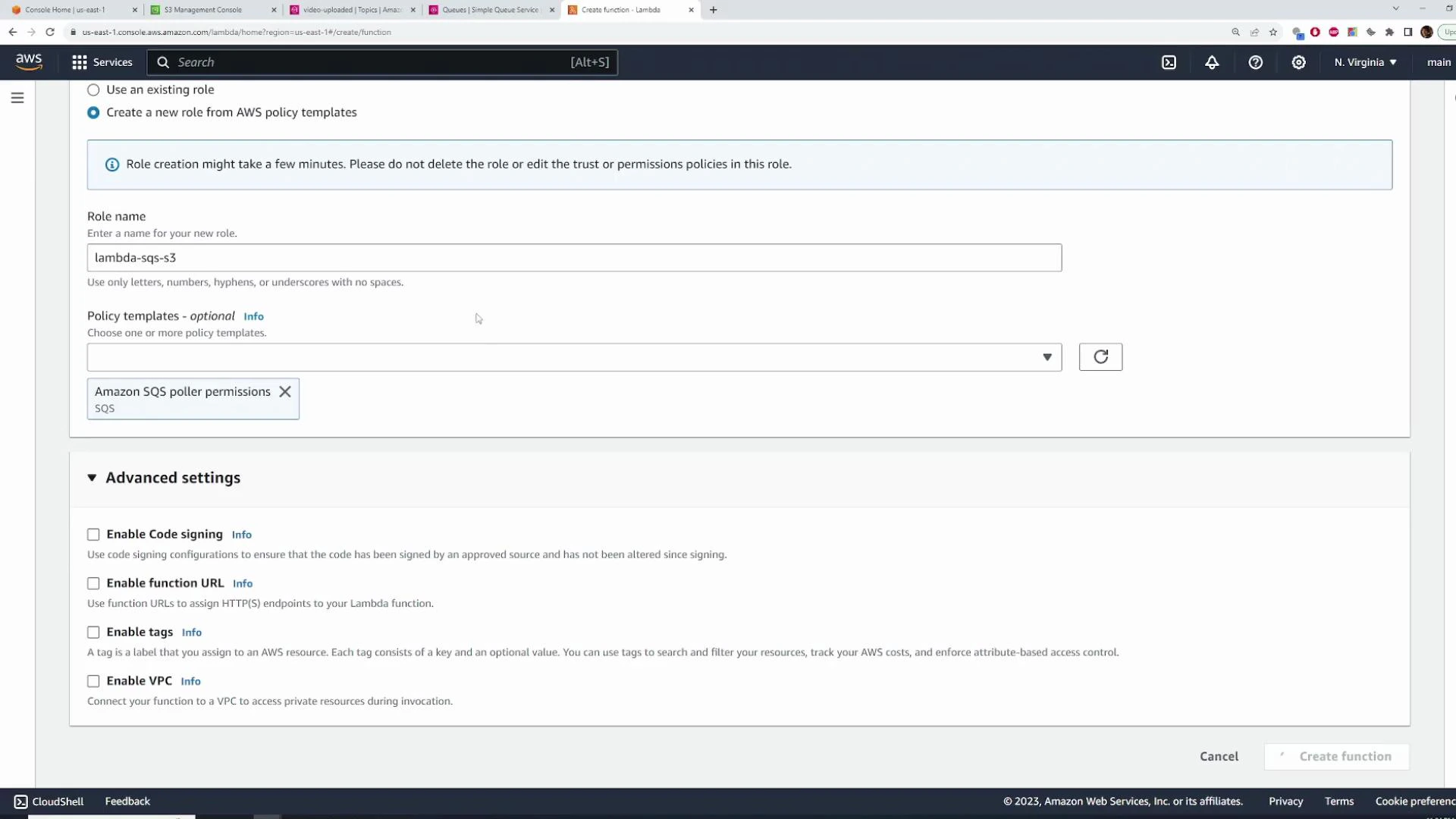 A screenshot of the AWS Lambda "Create function" page showing a new IAM role named "lambda-sqs-s3" with the "Amazon SQS poller permissions" policy selected. The lower section displays Advanced settings options (Enable Code signing, Enable function URL, Enable tags, Enable VPC).
