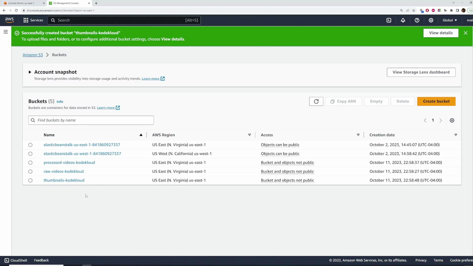 A screenshot of the AWS S3 Management Console showing a list of five S3 buckets with their names, regions, access settings, and creation dates. A green banner at the top indicates a bucket ("thumbnails-kodekloud") was successfully created.