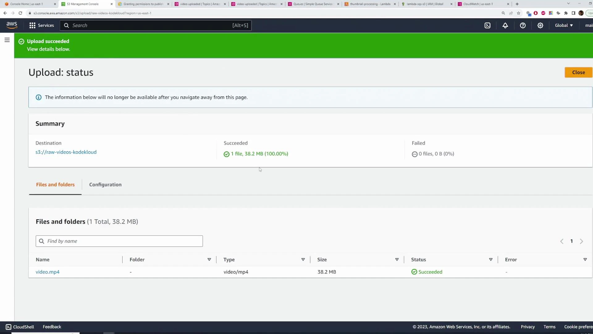 A screenshot of the AWS S3 console showing an "Upload succeeded" status with a summary that 1 file (video.mp4, 38.2 MB) was uploaded to the bucket s3://raw-videos-kodekloud. The file list below shows the upload succeeded with no errors.