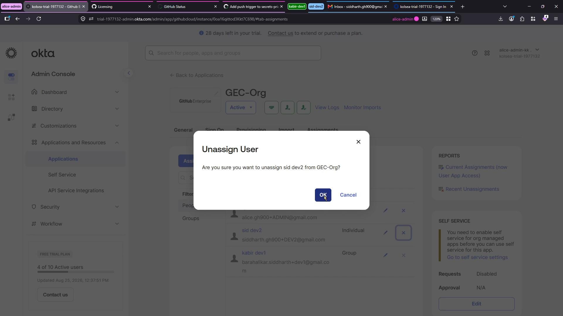 A screenshot of the Okta Admin Console with a confirmation dialog asking to unassign a user from an organization/app. The modal shows "OK" and "Cancel" buttons over the applications/assignments page.