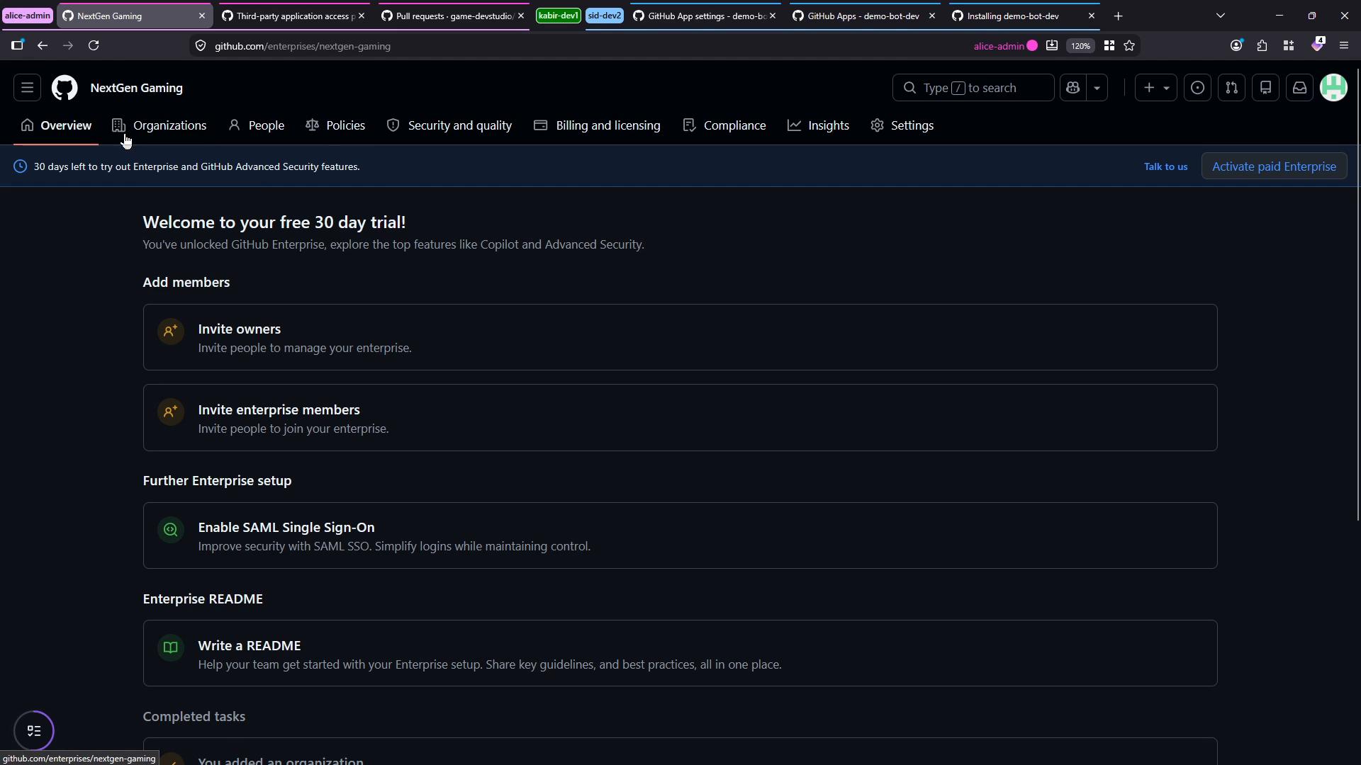 A dark-mode screenshot of a GitHub Enterprise "NextGen Gaming" admin dashboard showing a "Welcome to your free 30 day trial!" banner and setup options. The page lists actions like inviting owners and enterprise members, enabling SAML SSO, and writing a README.