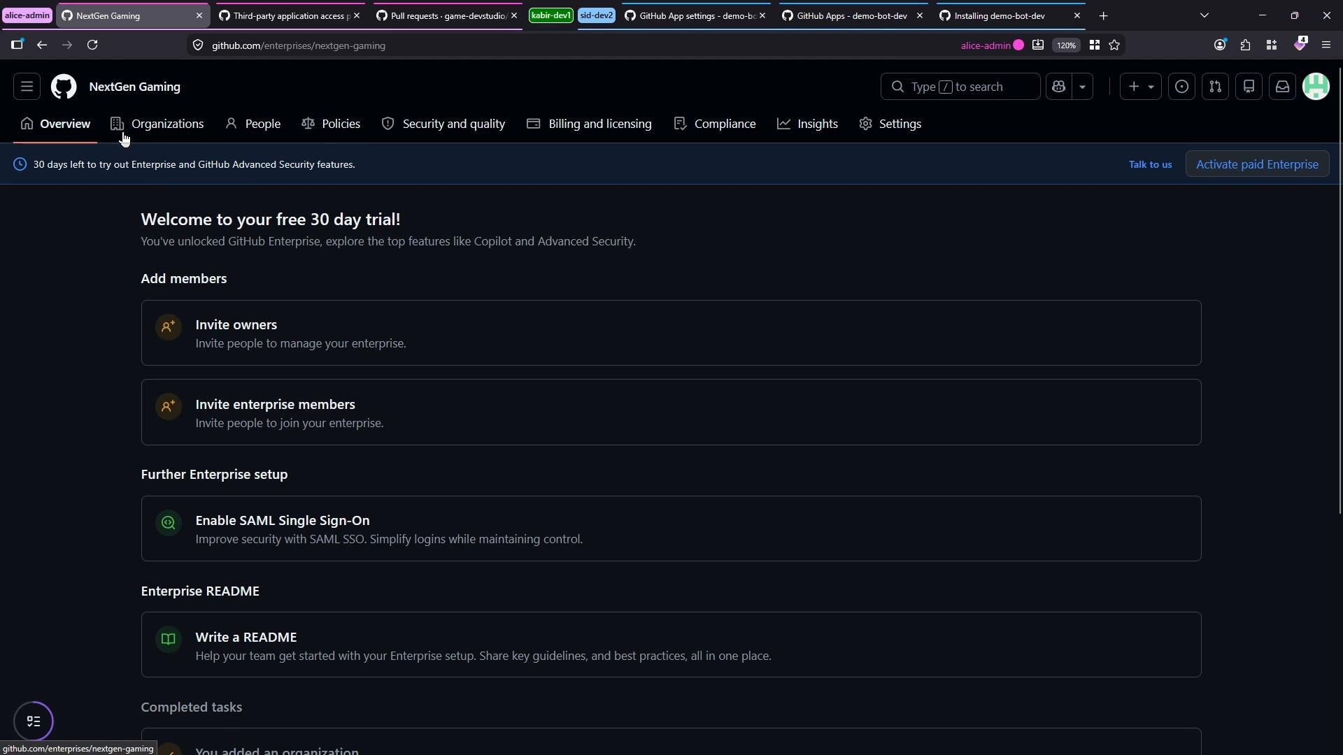 A dark-mode screenshot of a GitHub Enterprise "NextGen Gaming" admin dashboard showing a "Welcome to your free 30 day trial!" banner and setup options. The page lists actions like inviting owners and enterprise members, enabling SAML SSO, and writing a README.