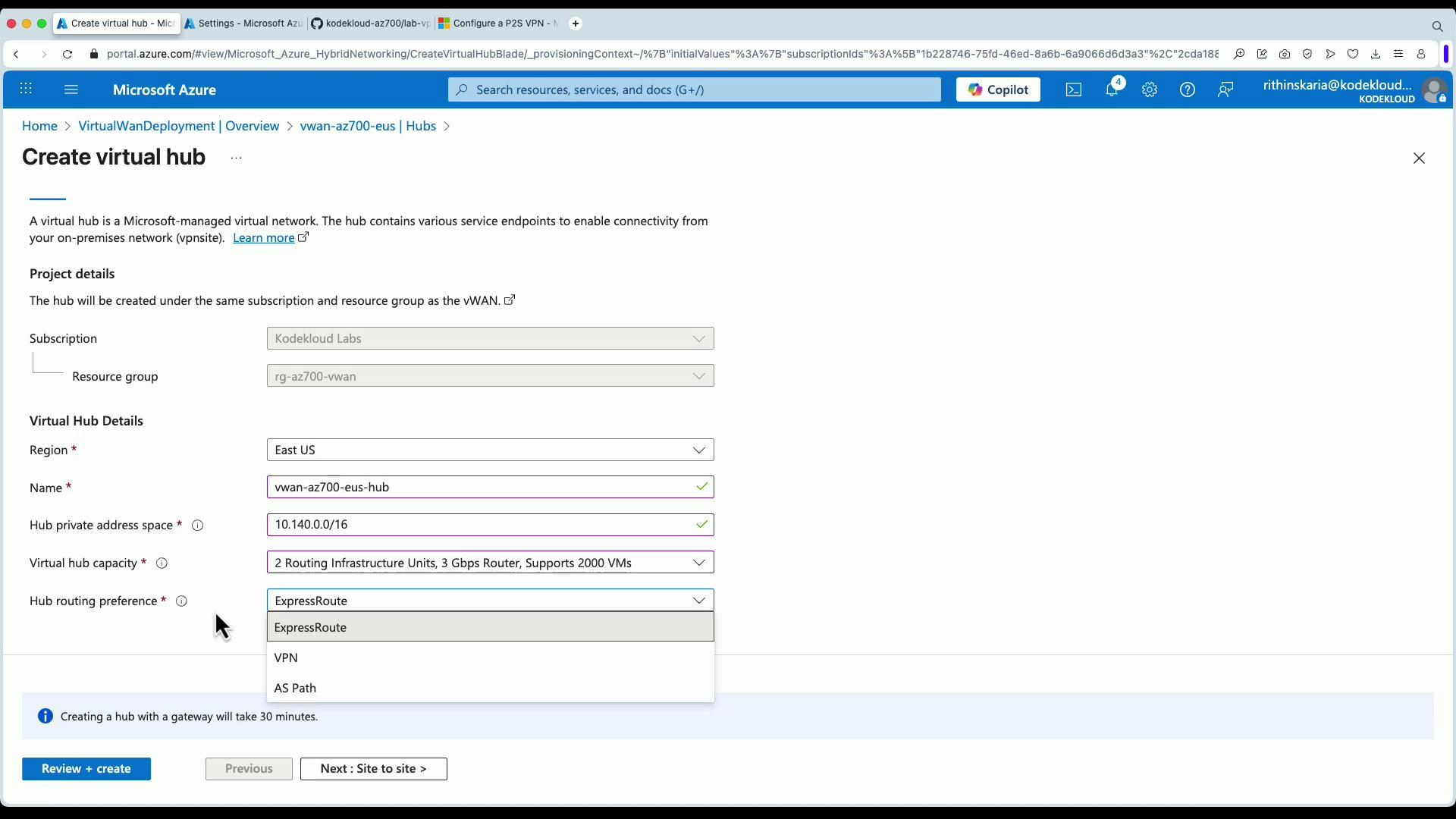 A screenshot of the Microsoft Azure portal displaying the "Create virtual hub" form with fields for subscription, resource group, region, hub name, private address space, capacity, and a "Hub routing preference" dropdown (ExpressRoute, VPN, AS Path). Buttons at the bottom include "Review + create" and "Next: Site to site."