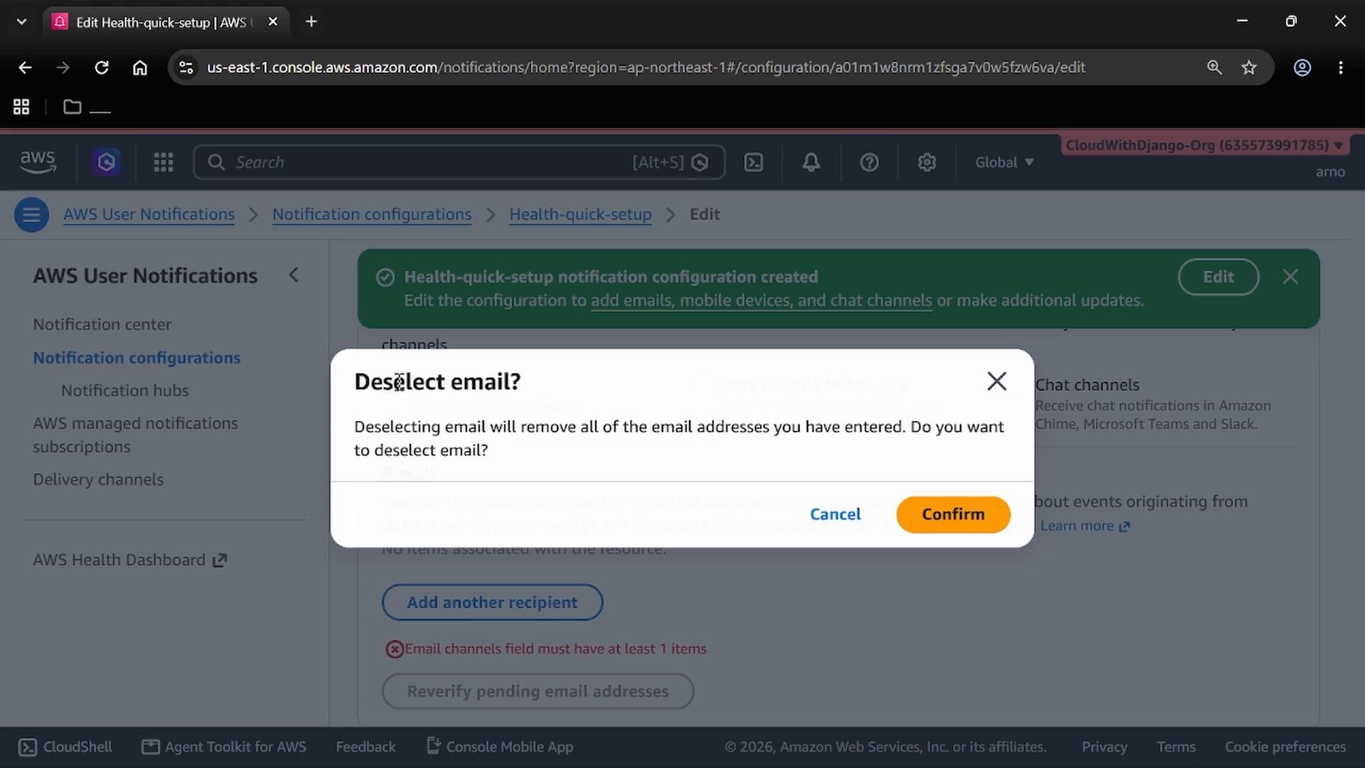A screenshot of the AWS User Notifications console with a pop-up dialog asking "Deselect email?" and warning that deselecting will remove all entered email addresses. The dialog shows "Cancel" and "Confirm" buttons over the Notification configurations page.