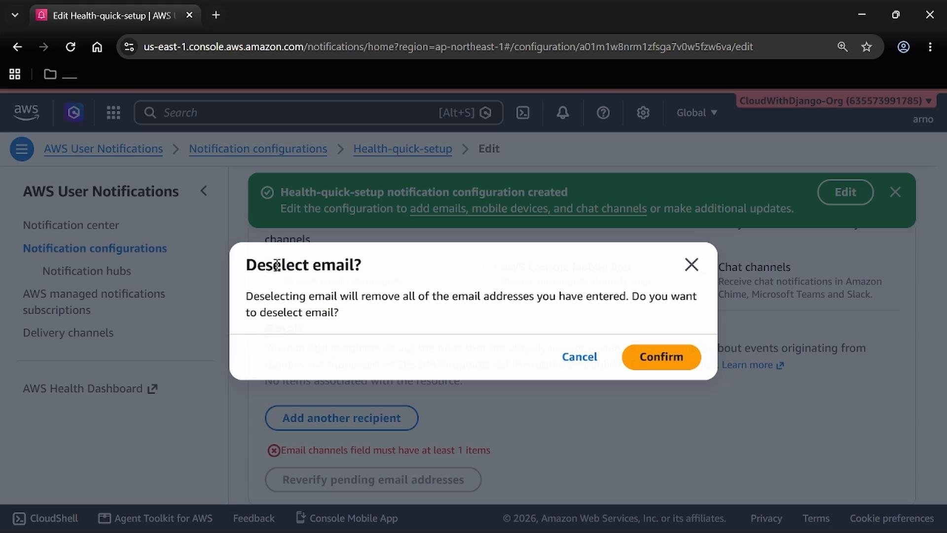 A screenshot of the AWS User Notifications console with a pop-up dialog asking "Deselect email?" and warning that deselecting will remove all entered email addresses. The dialog shows "Cancel" and "Confirm" buttons over the Notification configurations page.