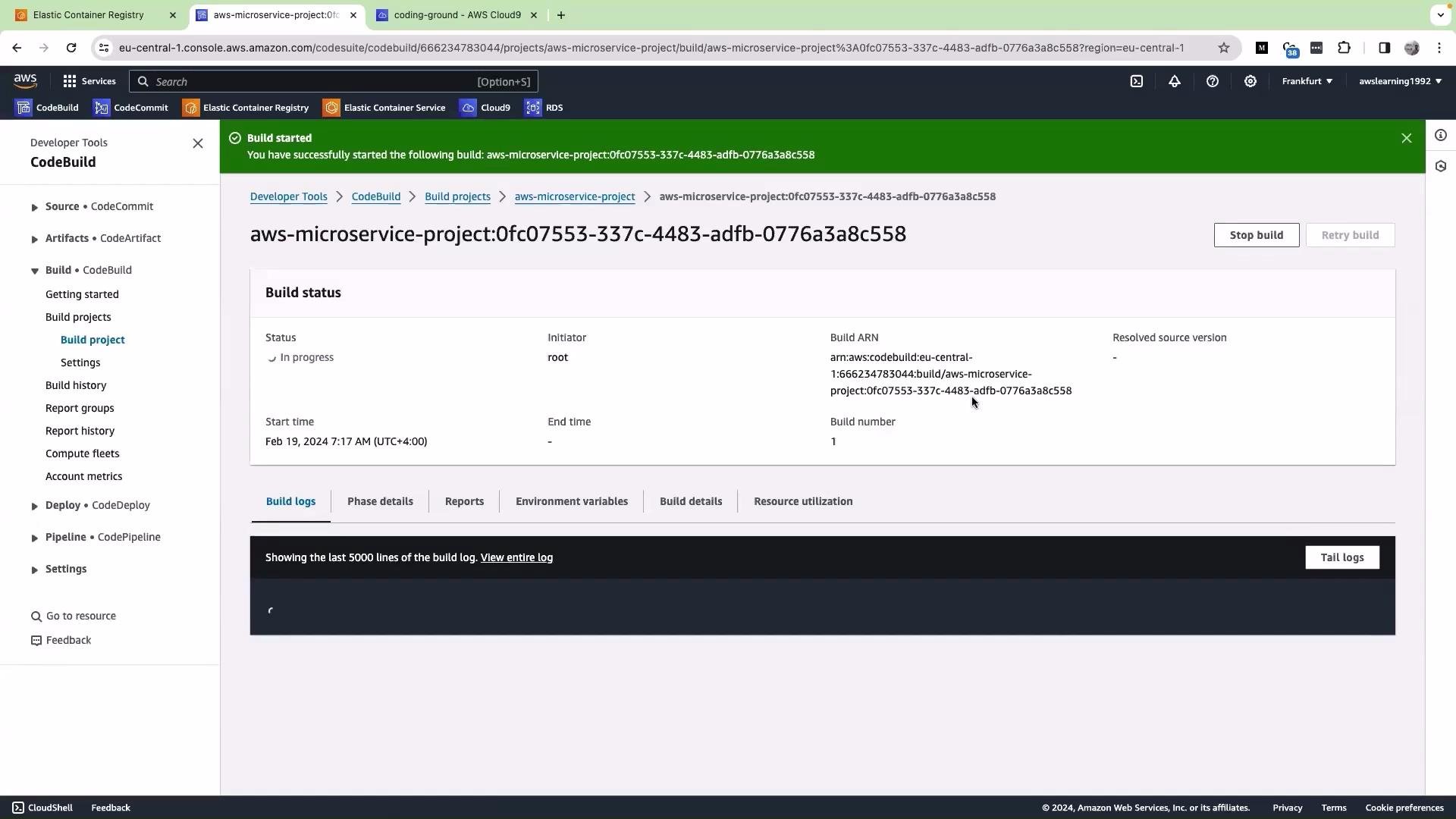 The image shows an AWS CodeBuild interface indicating the build status of a project named "aws-microservice-project", which is currently in progress. Details like the initiator, build ARN, and start time are displayed on the page.