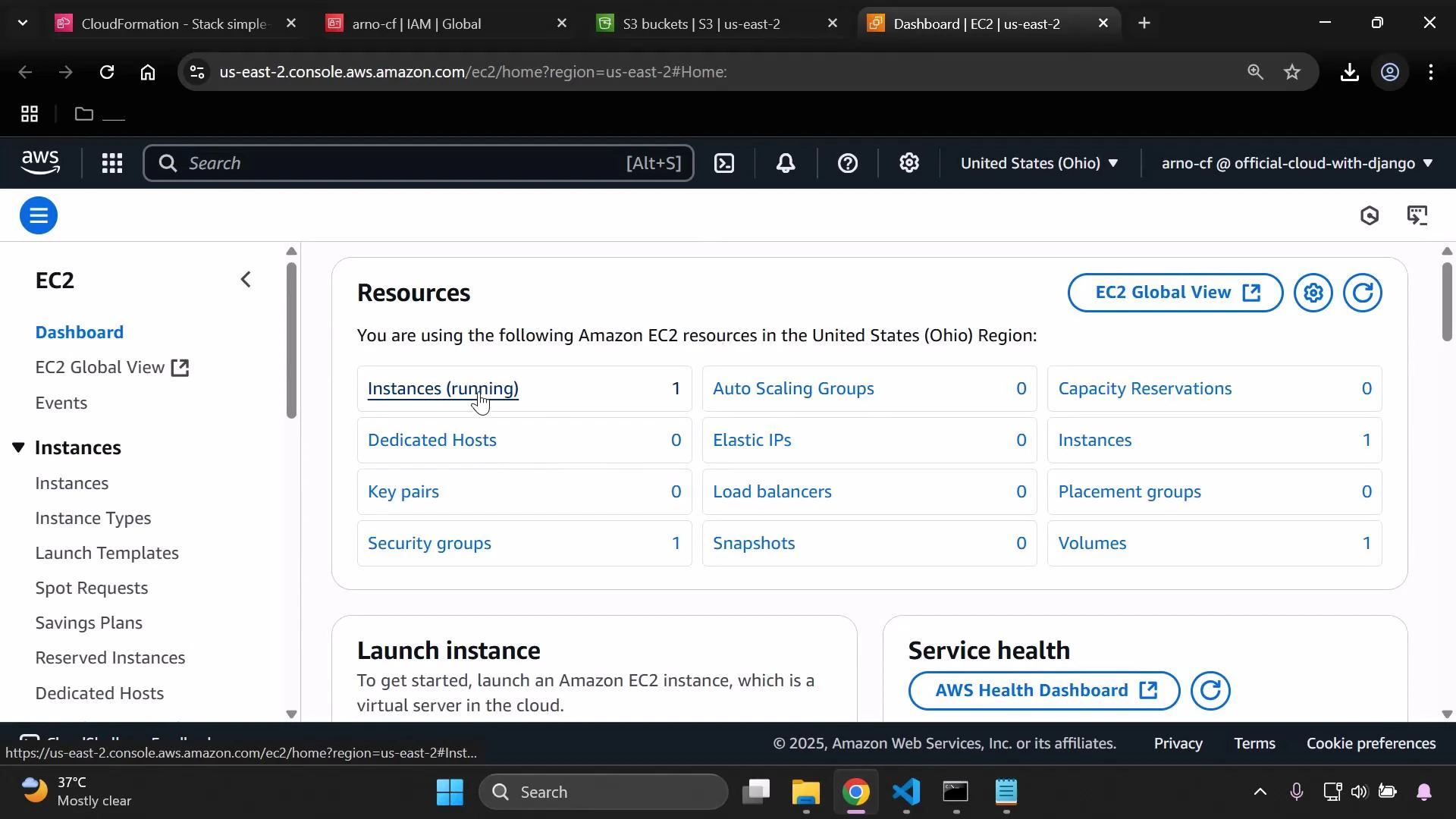 A screenshot of the AWS EC2 dashboard (US East — Ohio) showing the Resources panel with items like Instances (running): 1, Security groups: 1, Volumes: 1, etc. The browser window shows multiple open tabs and the Windows taskbar at the bottom.