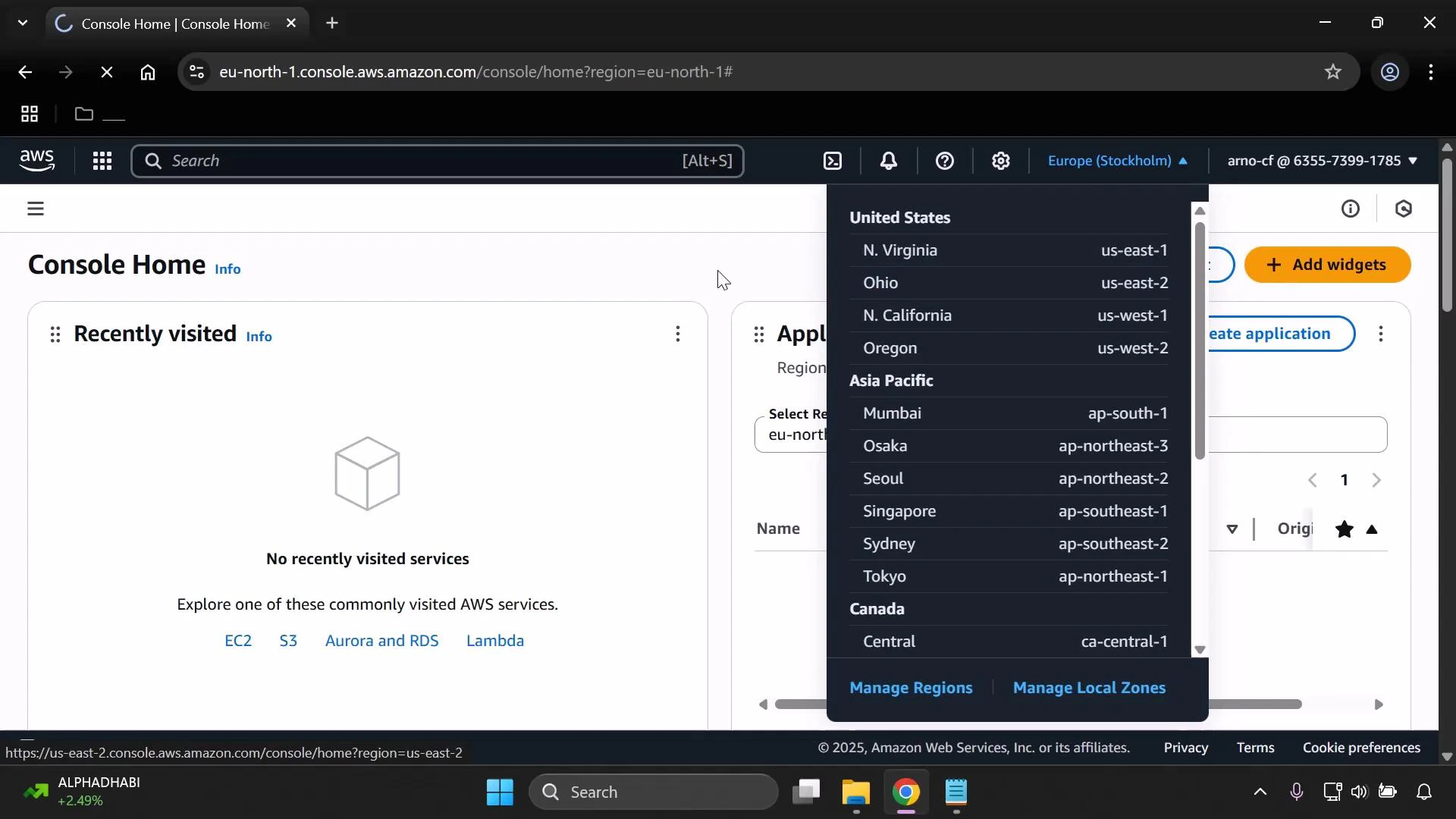 A screenshot of the AWS Management Console Home page with the region selector expanded, listing regions like N. Virginia, Ohio, Tokyo, and Mumbai. The main panel shows "No recently visited services," and the Windows taskbar is visible along the bottom.