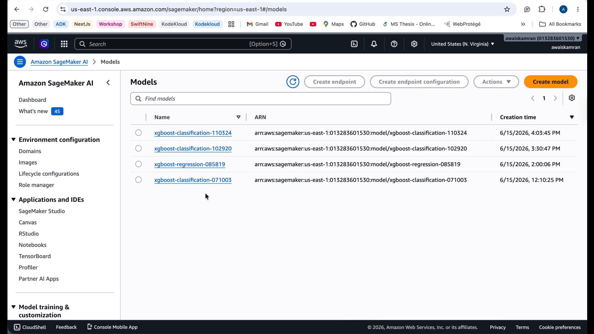 A screenshot of the Amazon SageMaker Models page showing a list of XGBoost models with their ARNs and creation timestamps. The left sidebar shows SageMaker navigation items like Environment configuration and Applications and IDEs.