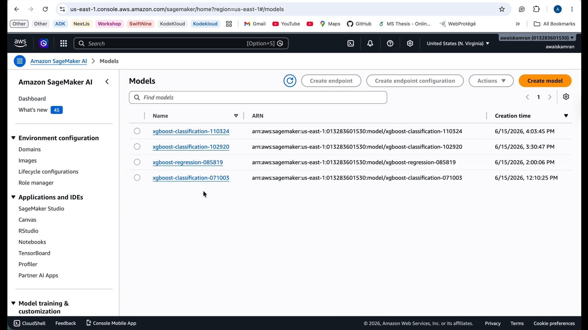 A screenshot of the Amazon SageMaker Models page showing a list of XGBoost models with their ARNs and creation timestamps. The left sidebar shows SageMaker navigation items like Environment configuration and Applications and IDEs.