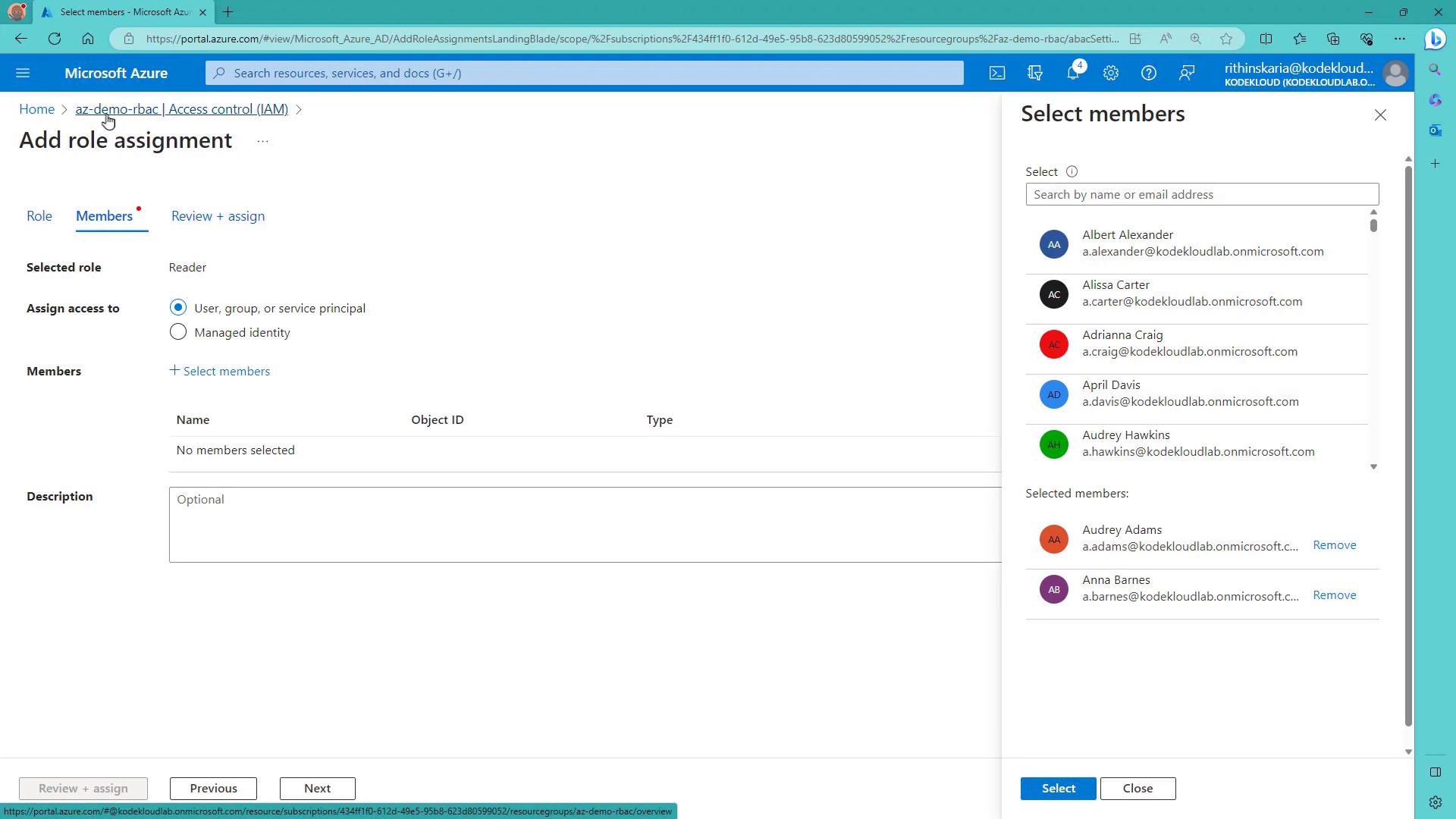 A screenshot of the Microsoft Azure portal showing the "Add role assignment" workflow with the Members tab active. A right-side "Select members" pane lists user accounts to choose for assigning the Reader role.