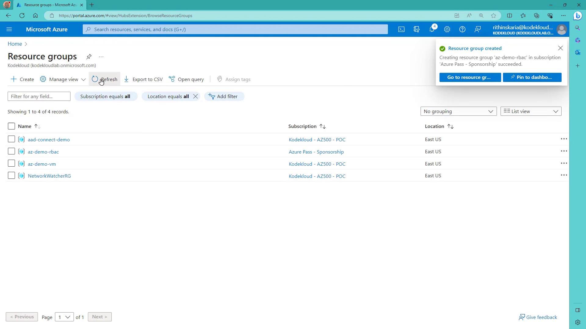 A screenshot of the Microsoft Azure portal showing the "Resource groups" page with a list of four resource groups (aad-connect-demo, az-demo-rbac, az-demo-vm, NetworkWatcherRG) and their subscriptions/locations. A notification in the top-right says a resource group was created.