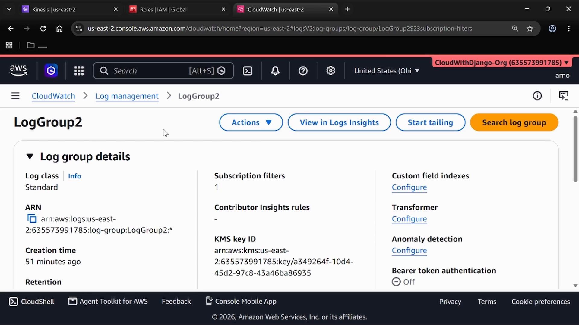 Screenshot of the AWS CloudWatch console showing the "LogGroup2" log group details page. It displays the log group's ARN, creation time, subscription filters, and configuration options like custom field indexes and transformers.