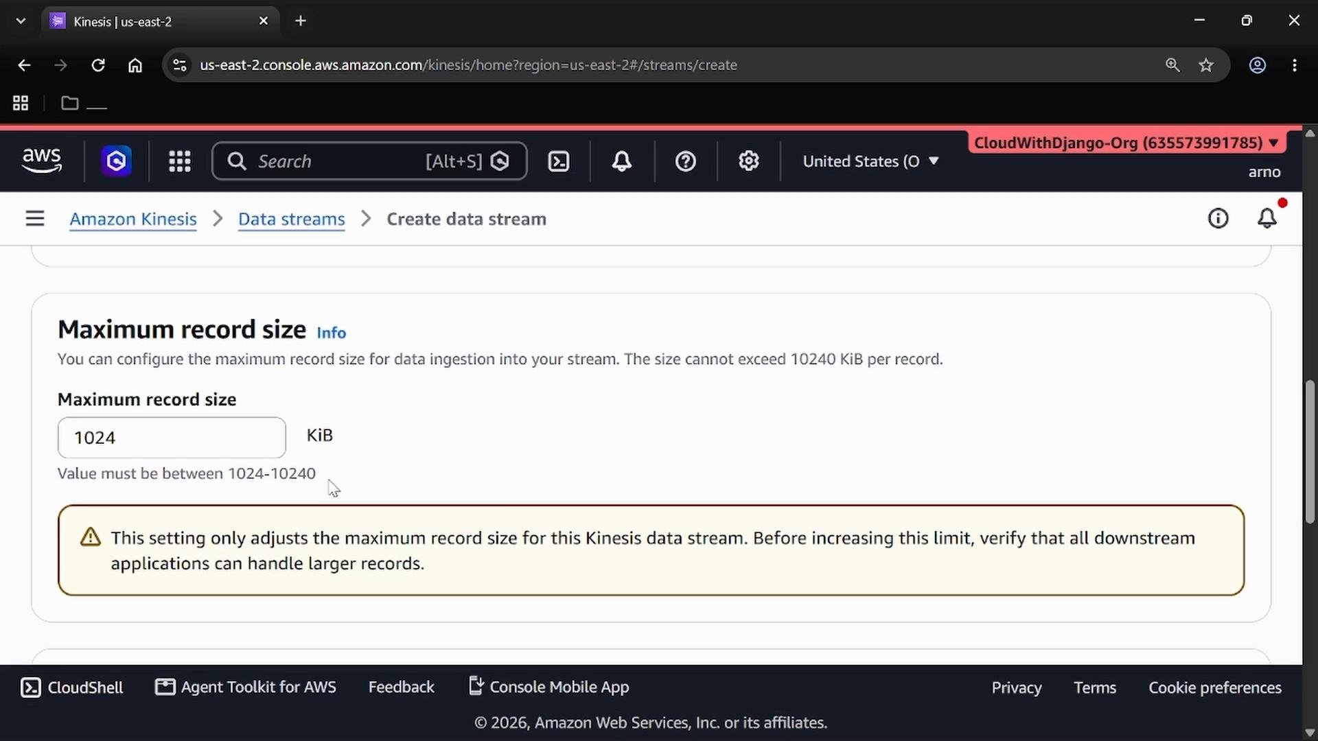 A screenshot of the Amazon Web Services console (Amazon Kinesis — Create data stream) showing the "Maximum record size" setting set to 1024 KiB. A warning box beneath advises verifying downstream applications can handle larger records.