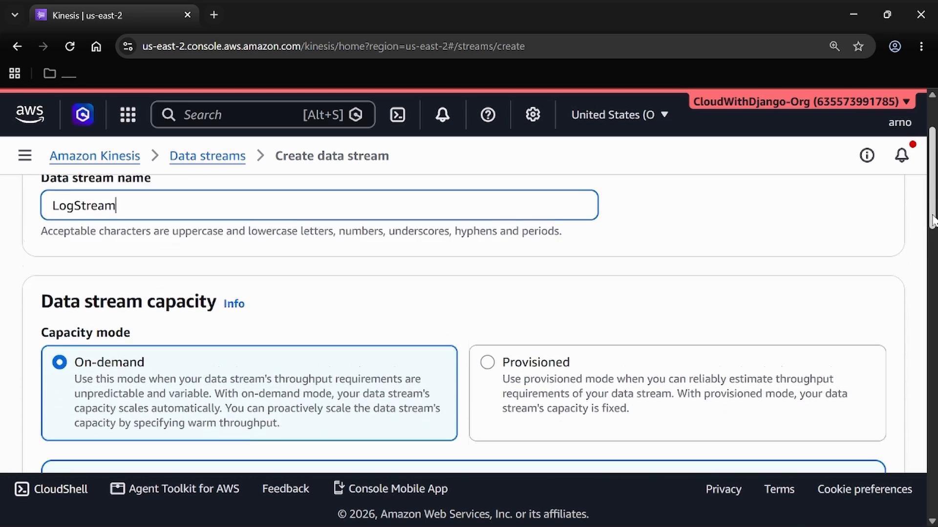 A screenshot of the AWS Management Console on the Amazon Kinesis "Create data stream" page, with the data stream name set to "LogStream." The page shows the "Data stream capacity" options including On-demand and Provisioned.