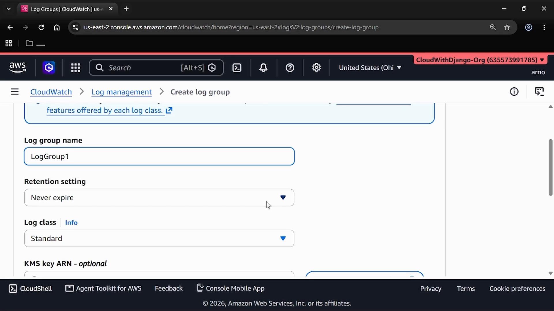 Screenshot of the AWS CloudWatch "Create log group" page showing form fields — the log group name is set to "LogGroup1", retention set to "Never expire" and log class "Standard." The browser AWS console header and navigation are visible across the top.