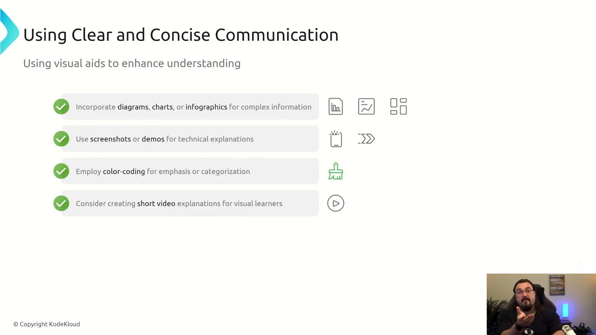 A presentation slide titled "Using Clear and Concise Communication" listing tips for visual aids—diagrams, screenshots, color-coding, and short videos—each with green check icons and small illustrative symbols. A small video feed of a presenter appears in the bottom-right corner.