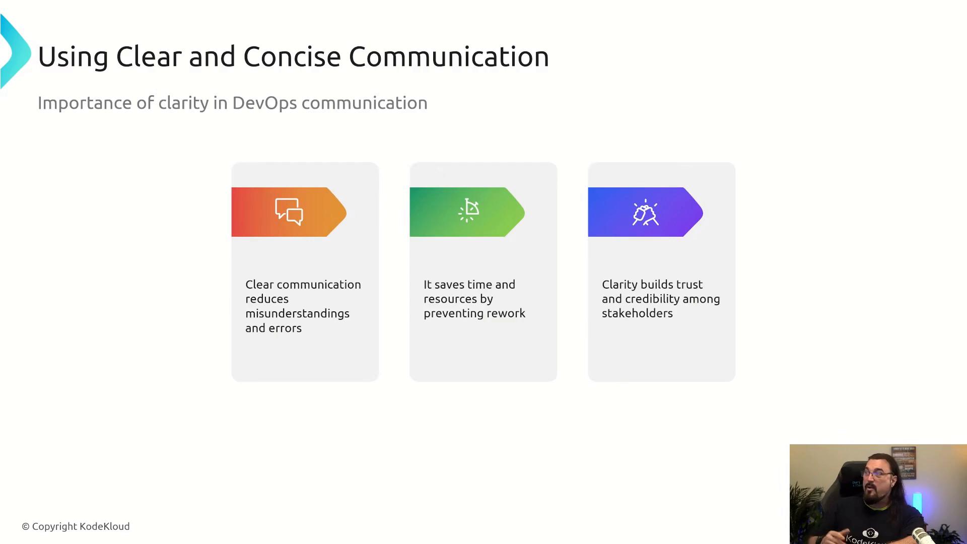 A presentation slide titled "Using Clear and Concise Communication" outlining the importance of clarity in DevOps with three colored panels listing benefits (fewer misunderstandings, time/resource savings, and building trust). A small video window of a presenter appears in the bottom-right corner.