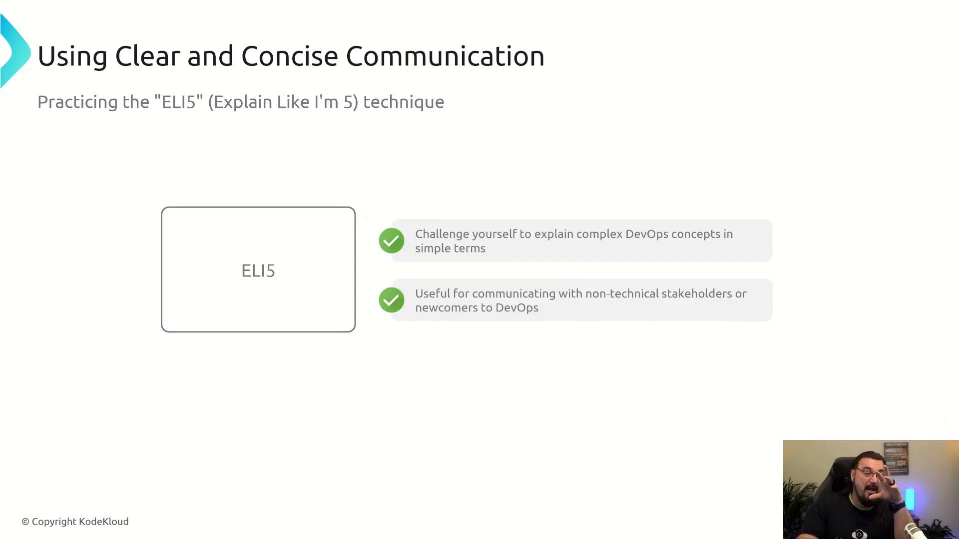 A presentation slide titled "Using Clear and Concise Communication" describing the "ELI5 (Explain Like I'm 5)" technique with notes about simplifying DevOps concepts and communicating with non-technical stakeholders. A small webcam overlay in the bottom-right shows a person speaking.