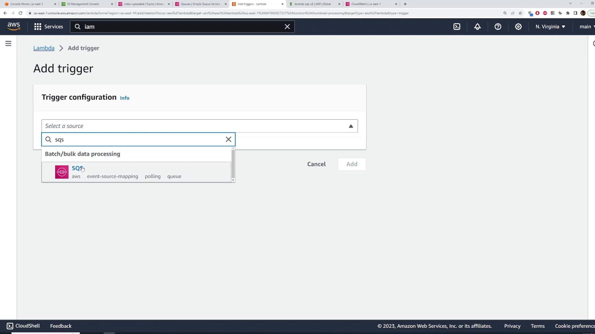 Screenshot of the AWS Lambda "Add trigger" page showing the Trigger configuration panel with "sqs" typed into the source dropdown and the SQS option highlighted. The Cancel and Add buttons are visible at the bottom.