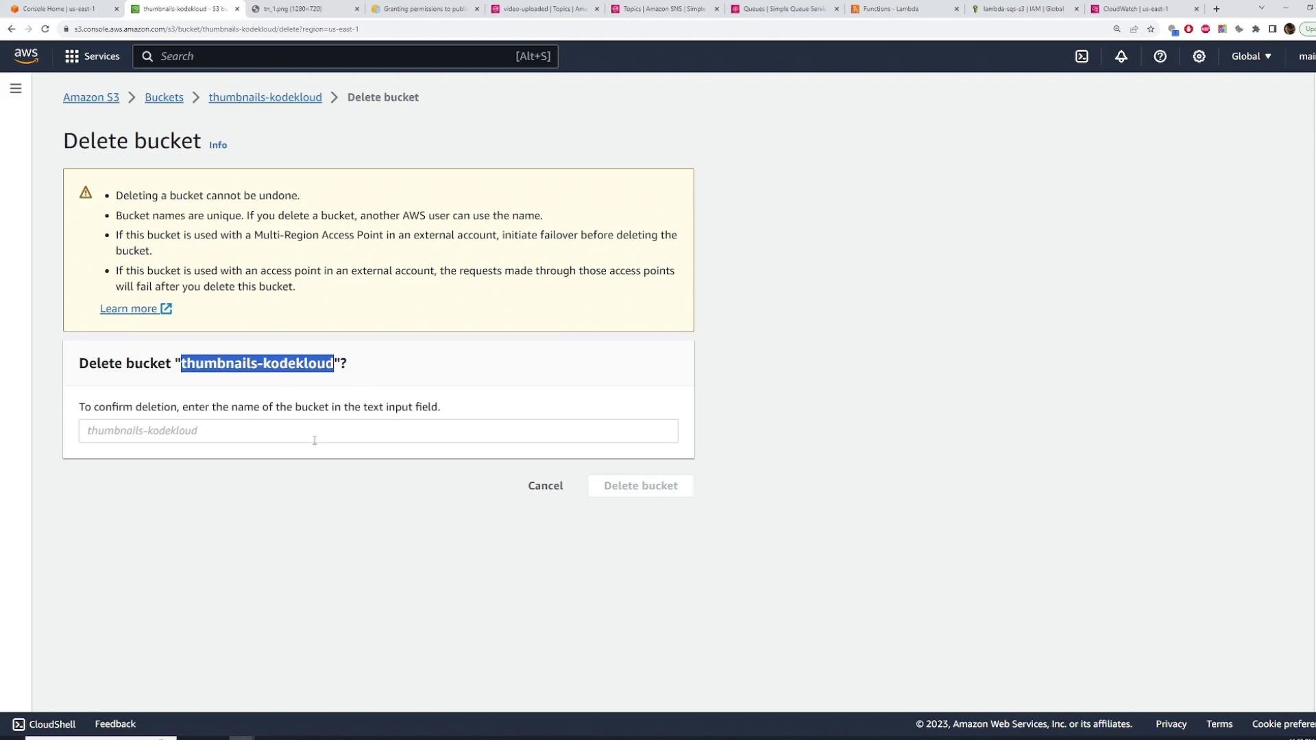 A screenshot of the AWS S3 console showing the "Delete bucket" confirmation for the bucket "thumbnails-kodekloud". It shows warning text about irreversible deletion and an input field to type the bucket name to confirm.