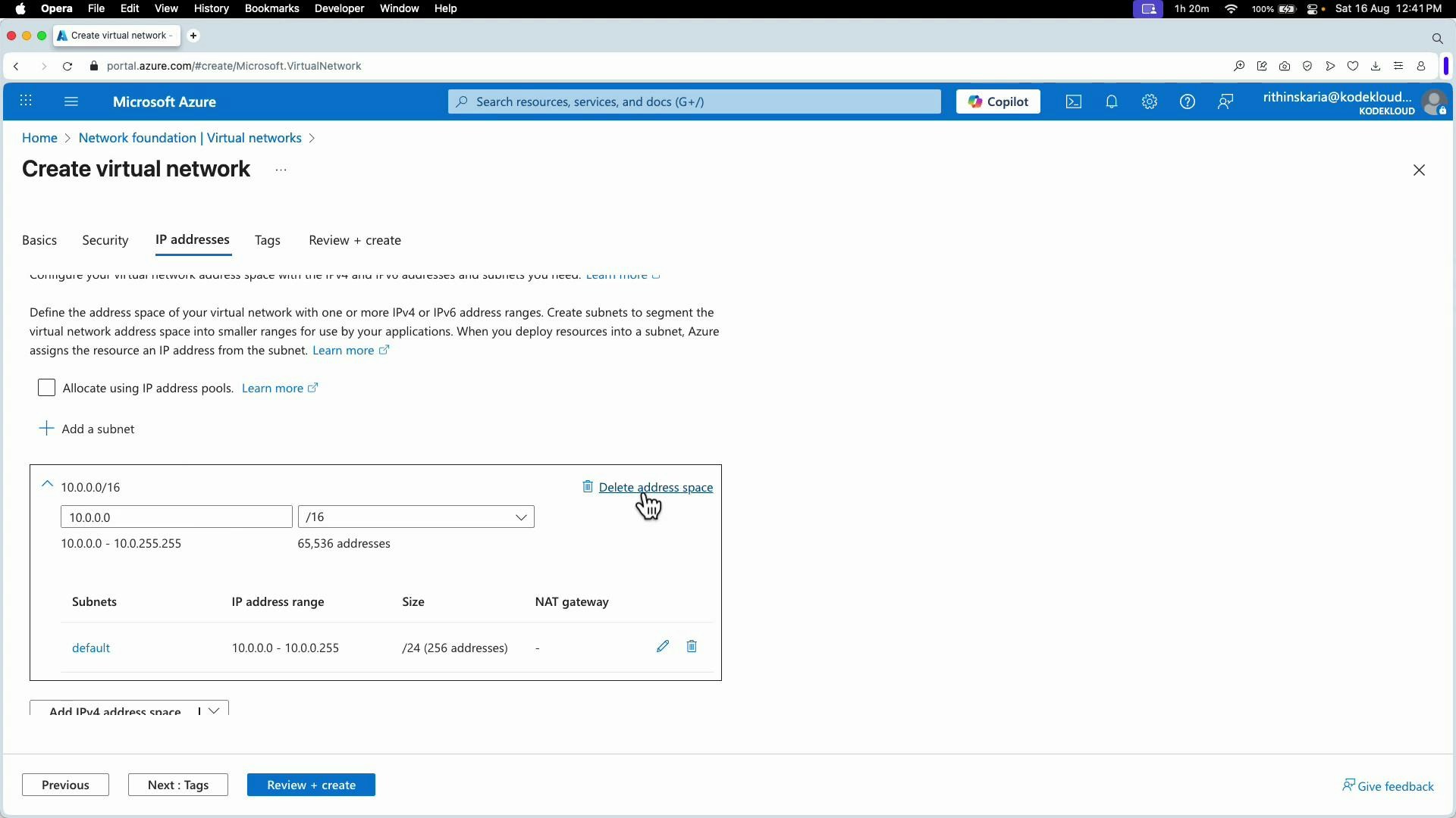 A screenshot of the Microsoft Azure portal’s "Create virtual network" page on the IP addresses tab, showing a 10.0.0.0/16 address space and a default 10.0.0.0/24 subnet. The page includes controls for adding subnets, deleting the address space, and a "Review + create" button.