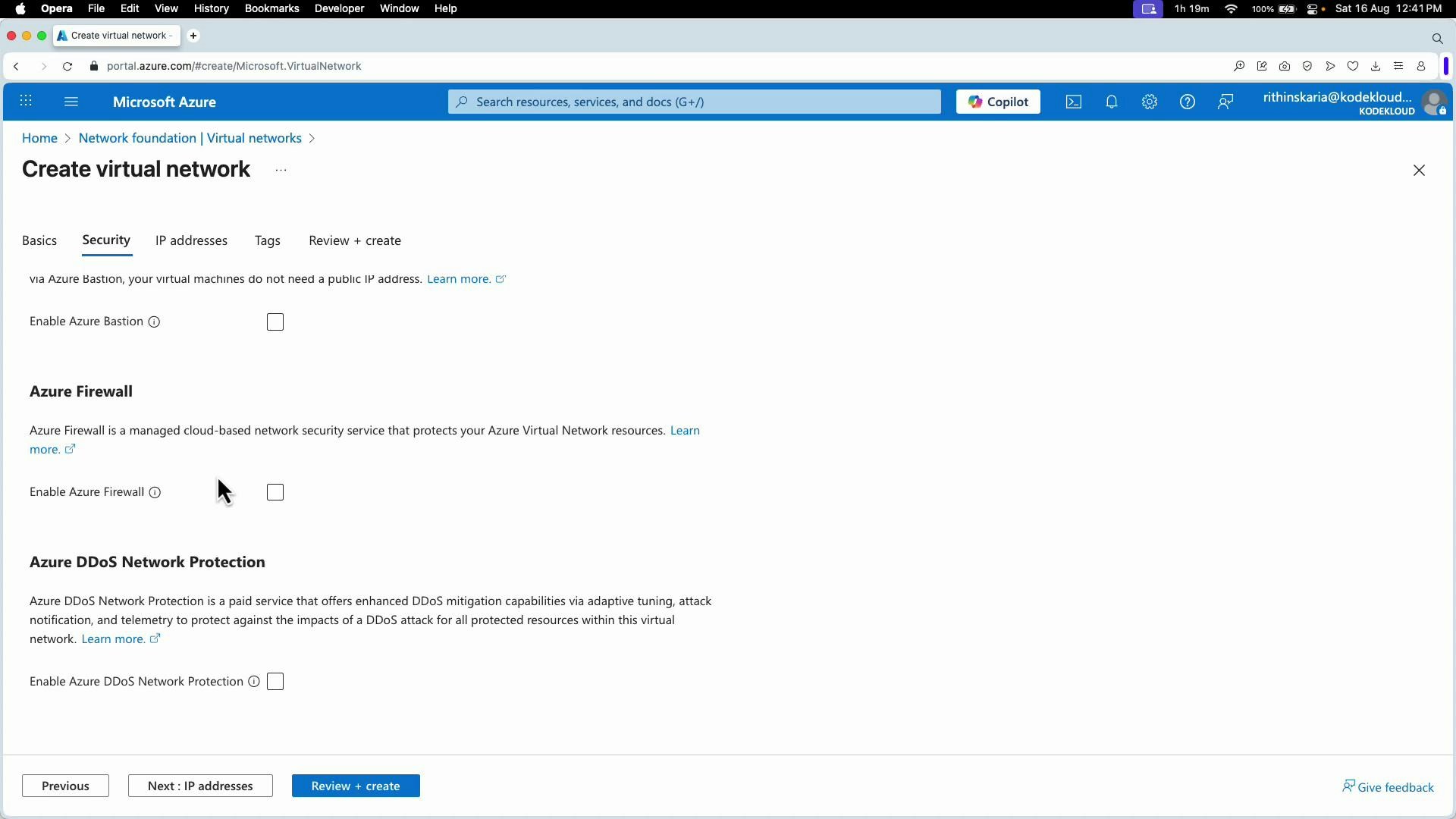 A screenshot of the Microsoft Azure portal showing the "Create virtual network" page on the Security tab with options to enable Azure Bastion, Azure Firewall, and Azure DDoS Network Protection. The top navigation bar and bottom navigation buttons (Previous, Next: IP addresses, Review + create) are also visible.