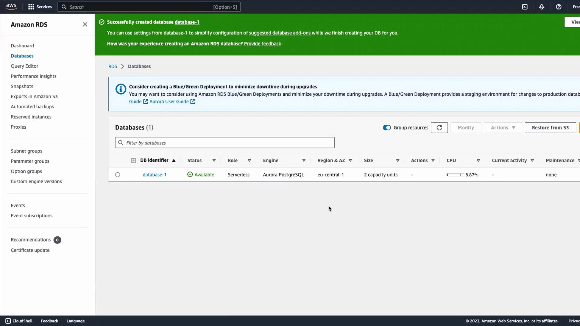 Screenshot of the Amazon RDS console with a green success banner saying "Successfully created database database-1." The Databases list shows one available Aurora PostgreSQL Serverless instance (database-1) in eu-central-1.