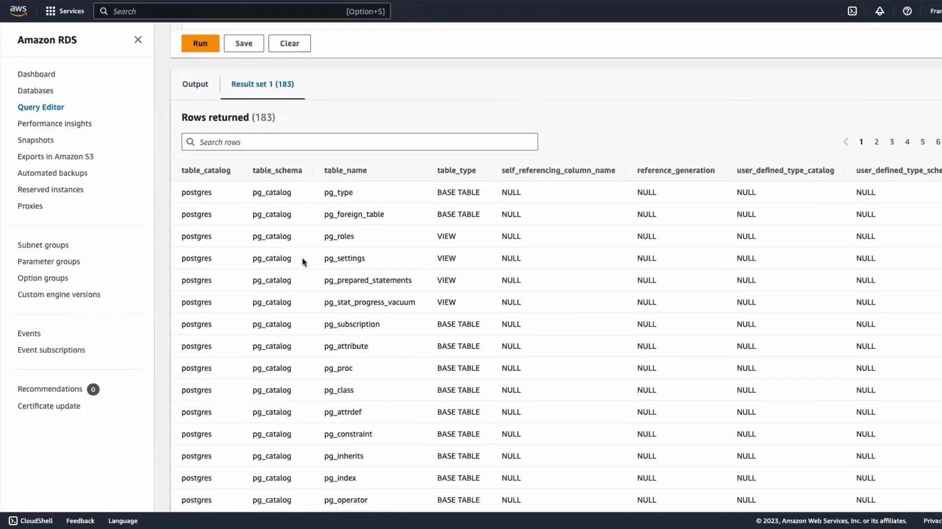Screenshot of the Amazon RDS Query Editor showing a result set (183 rows) listing PostgreSQL catalog tables. The table displays columns like table_catalog, table_schema, table_name and table_type with entries such as pg_type, pg_roles and pg_settings.