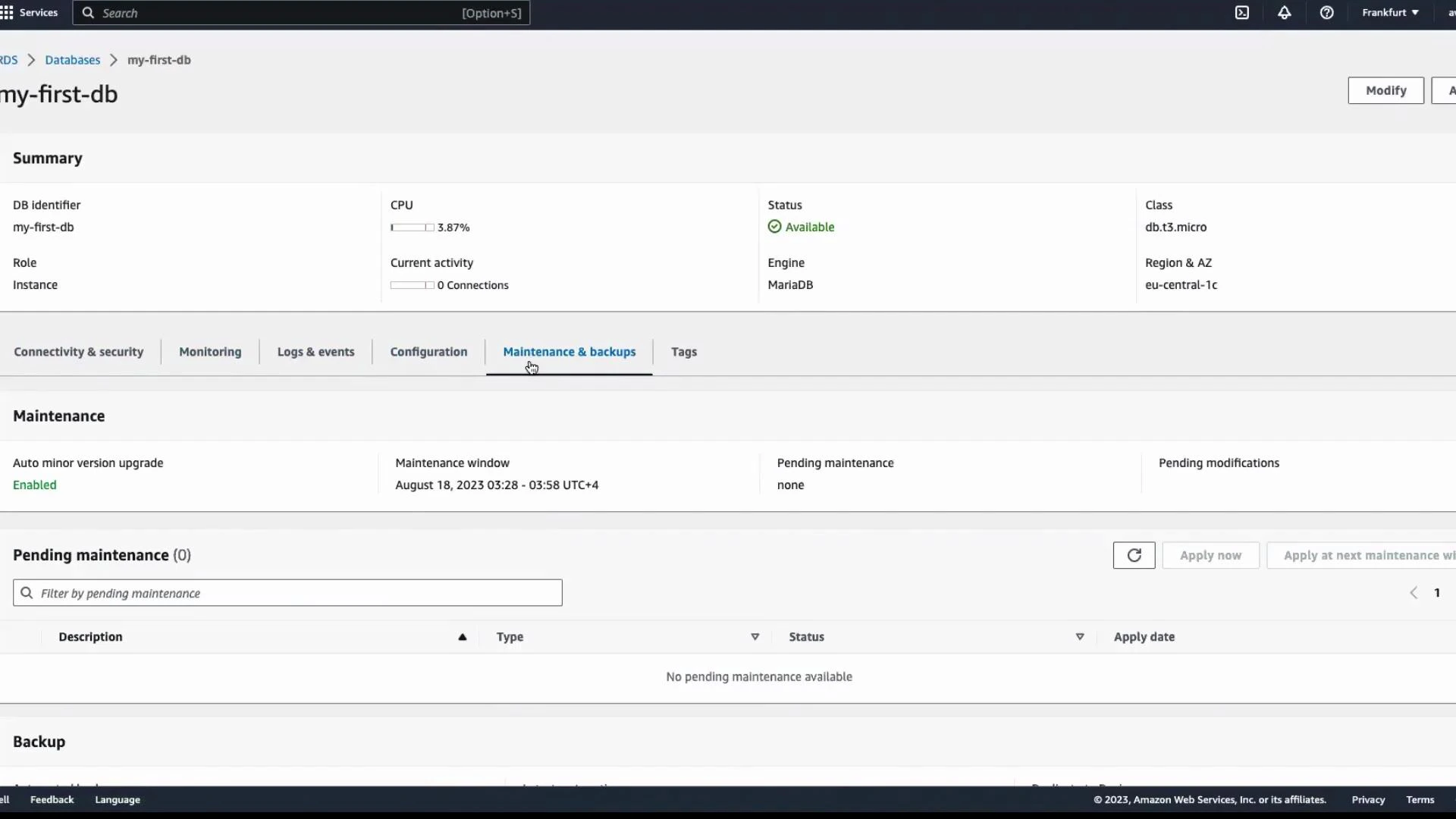 A screenshot of the Amazon RDS console showing a database instance named "my-first-db" (Engine: MariaDB, Status: Available, Class: db.t3.micro). The Maintenance & backups tab shows auto minor version upgrades enabled, a maintenance window on August 18, 2023, and no pending maintenance.