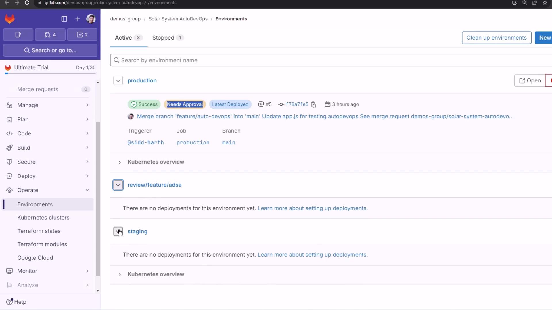 A GitLab web UI screenshot showing the "Environments" page for a project with entries for production, review/feature/adsa, and staging. The production row shows deployment badges (Success, Needs Approval, Latest Deployed) plus trigger, job, and branch details.