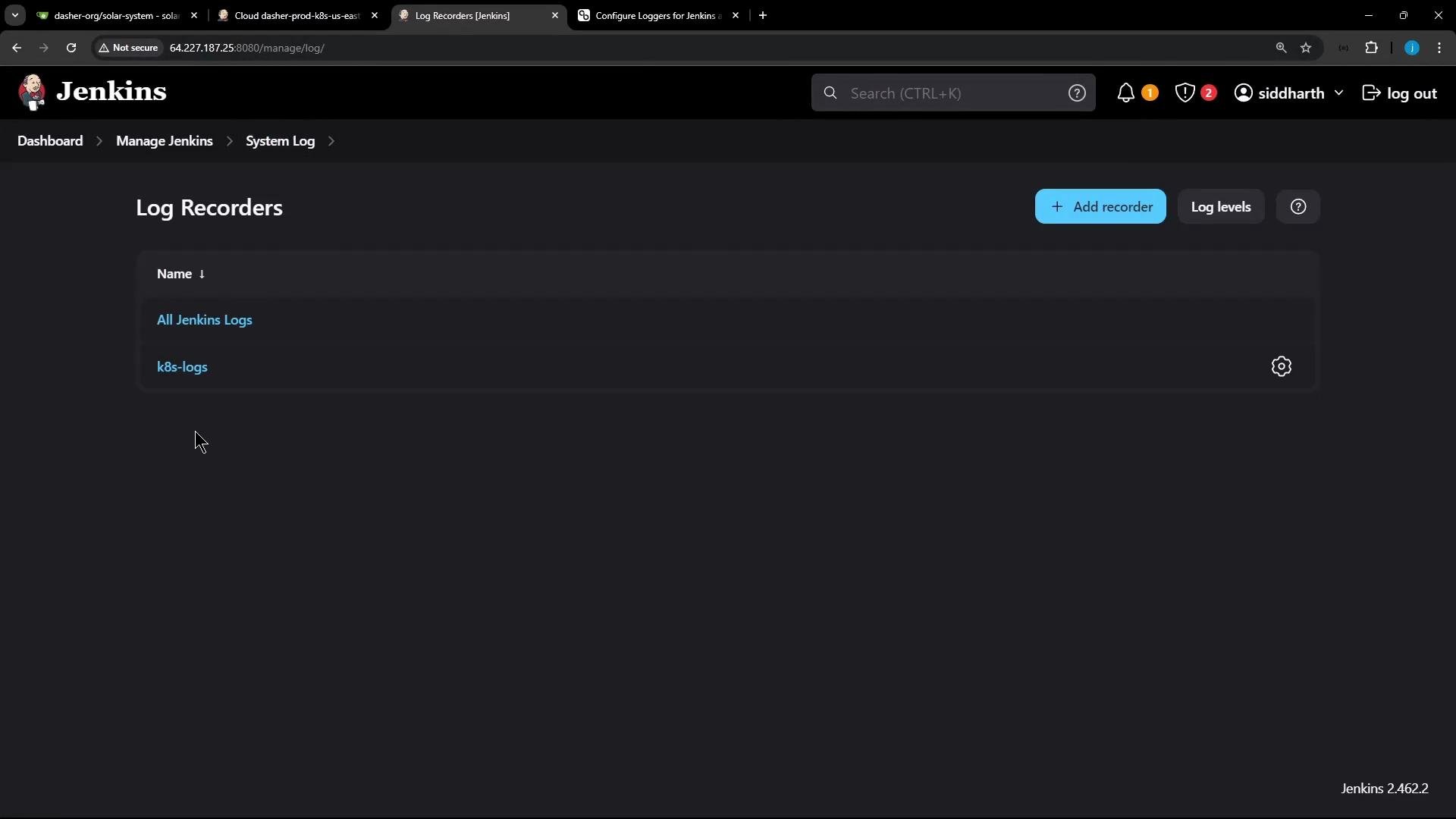 Screenshot of the Jenkins web UI (dark theme) showing the "Log Recorders" page with entries "All Jenkins Logs" and "k8s-logs." The top bar includes breadcrumbs and buttons for "Add recorder" and "Log levels."