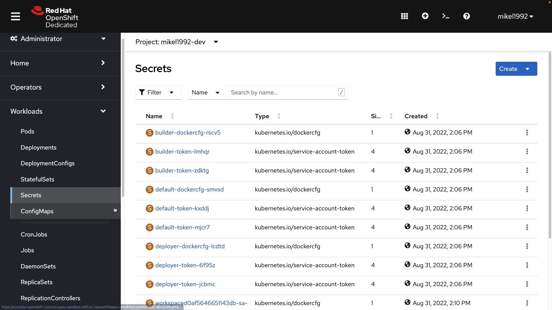 A screenshot of the Red Hat OpenShift Dedicated web console showing the "Secrets" page for project "mikel1992-dev." The table lists secret names (e.g., builder-token, default-token, deployer-token), their Kubernetes types, sizes and creation timestamps.