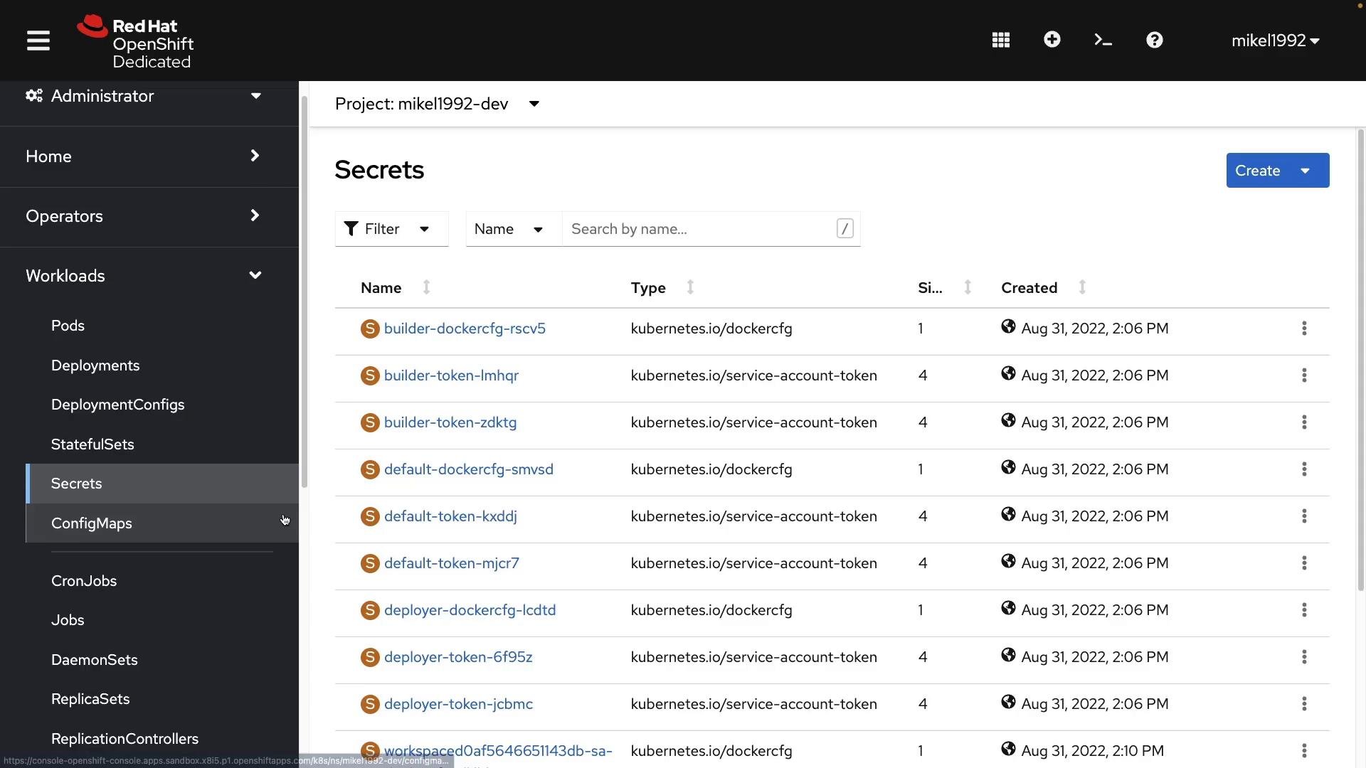 A screenshot of the Red Hat OpenShift Dedicated web console showing the "Secrets" page for project "mikel1992-dev." The table lists secret names (e.g., builder-token, default-token, deployer-token), their Kubernetes types, sizes and creation timestamps.