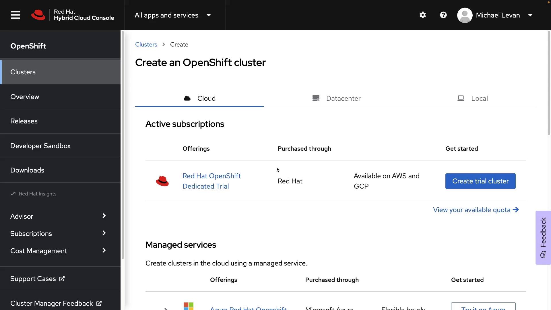 A screenshot of the Red Hat Hybrid Cloud Console showing the "Create an OpenShift cluster" page with Active subscriptions and a "Create trial cluster" button. The left sidebar displays navigation items like Clusters, Overview, Releases, and Downloads.