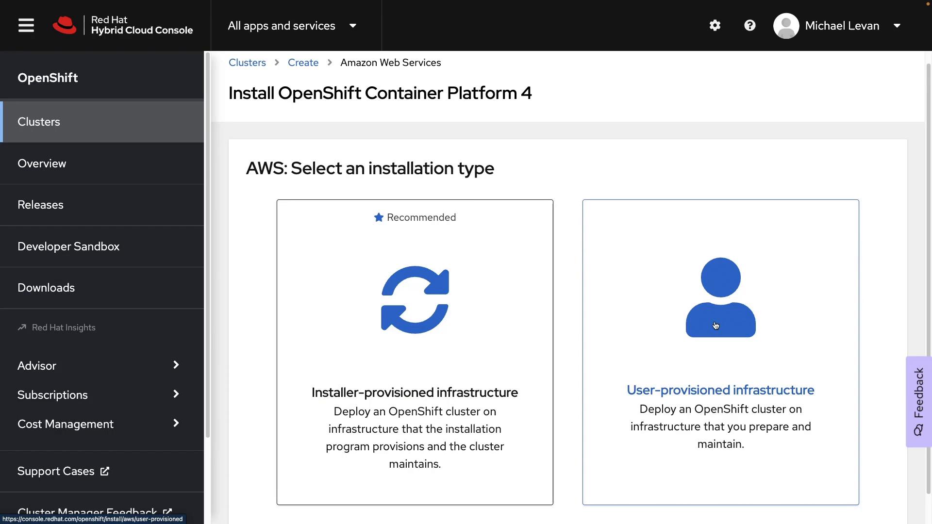 A screenshot of the Red Hat Hybrid Cloud Console showing the "Install OpenShift Container Platform 4" page where you choose an AWS installation type. Two option cards are visible: "Installer‑provisioned infrastructure" (recommended) and "User‑provisioned infrastructure."