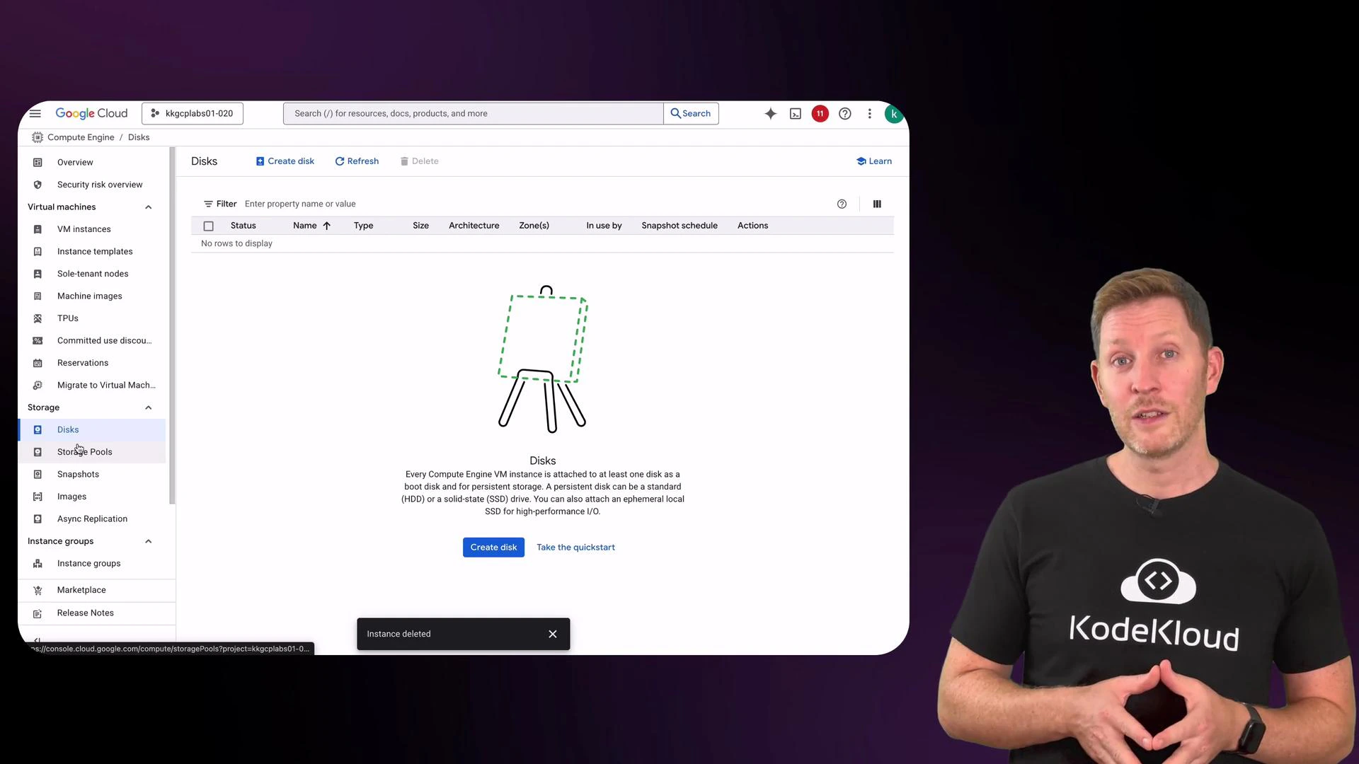 An instructor wearing a black KodeKloud t‑shirt stands to the right of a large screenshot of the Google Cloud Console showing the empty "Disks" page. The console display includes the left navigation menu, a central illustration, and a blue "Create disk" button.