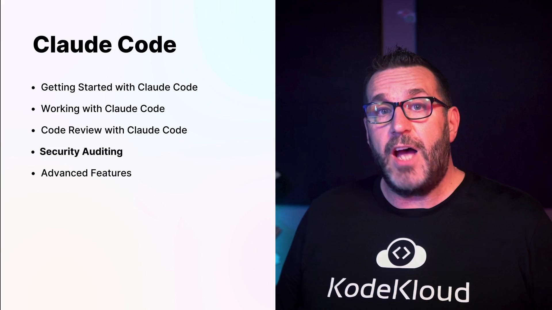 A presentation slide titled "Claude Code" lists topics like Getting Started, Working with Claude Code, Code Review, Security Auditing, and Advanced Features. To the right, a bearded man wearing glasses and a KodeKloud T-shirt is speaking on camera.