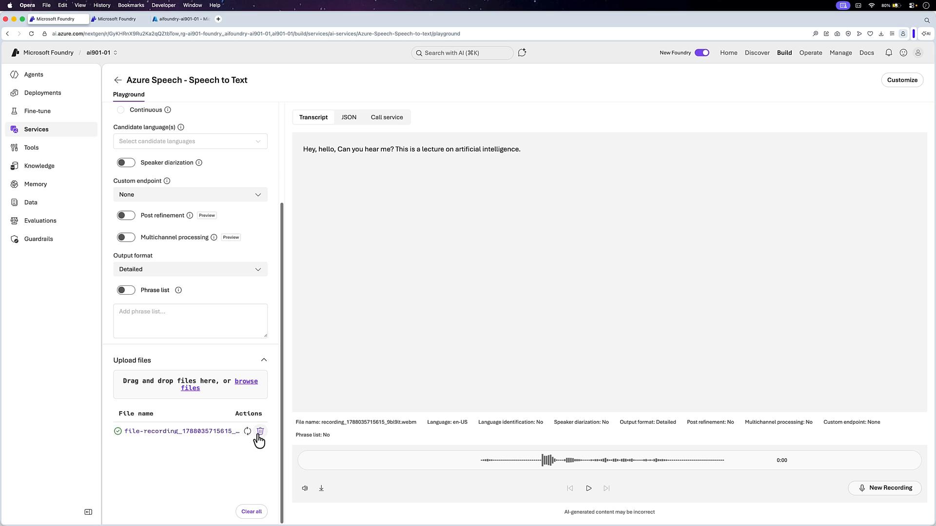 A screenshot of the Microsoft Foundry / Azure Speech-to-Text playground showing transcription settings on the left and a transcript panel on the right that reads, "Hey, hello, Can you hear me? This is a lecture on artificial intelligence." A waveform player and uploaded audio file controls are visible along the bottom.