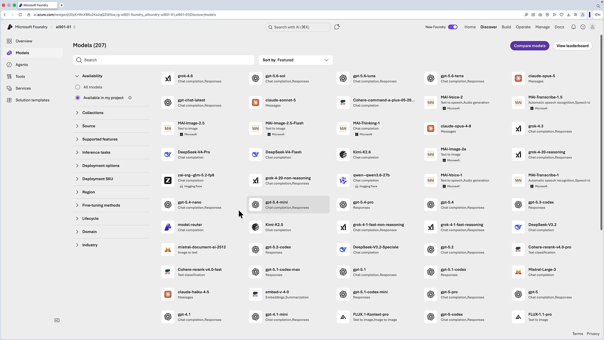 A browser screenshot of the Microsoft Foundry/Azure AI "Models" page showing a searchable catalog of many AI models (GPT, Claude, Grok, MAI, etc.) with filters in a left sidebar and model tiles arranged in columns. The top bar includes navigation and compare/view leaderboard buttons.