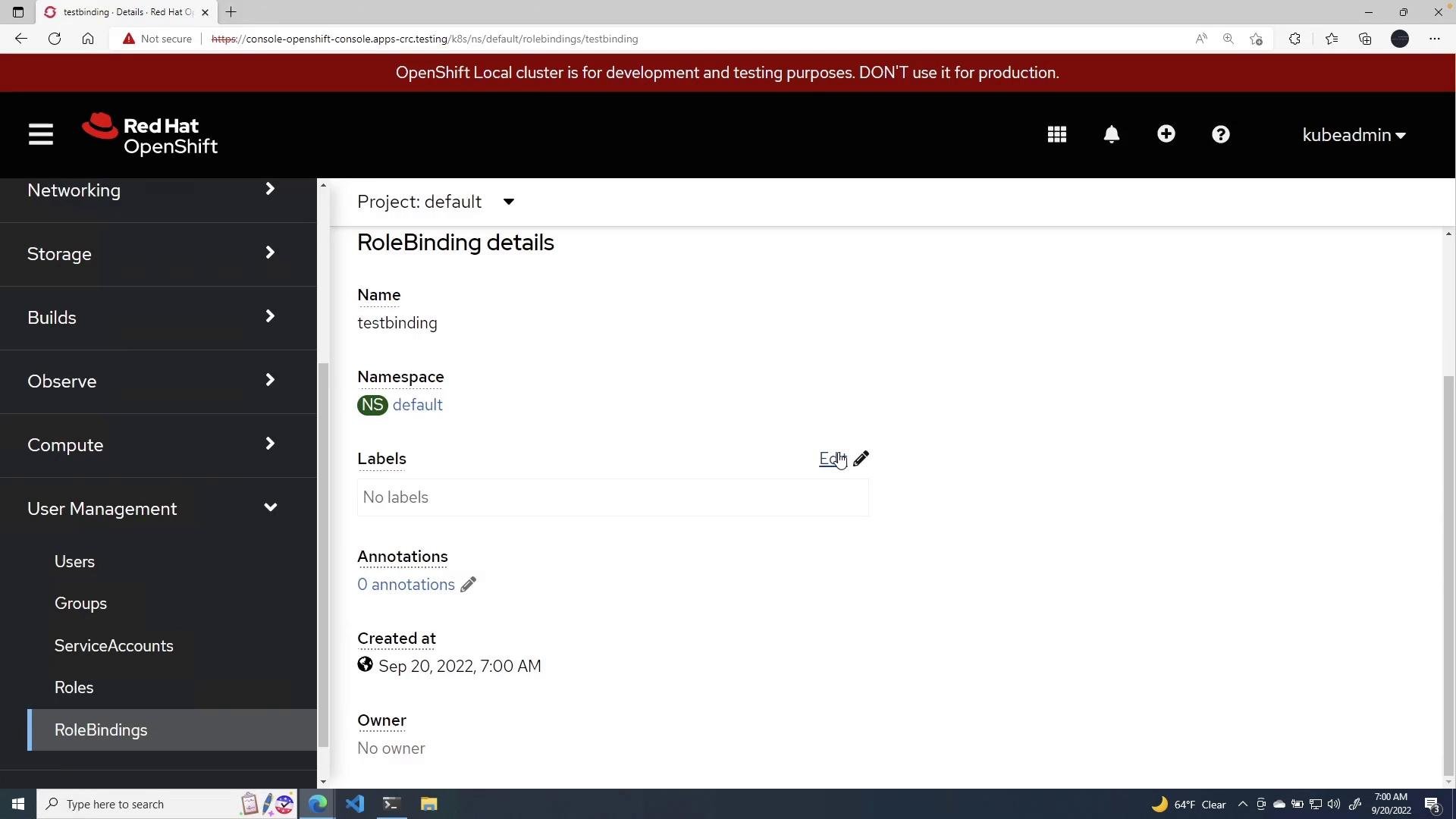 A screenshot of the Red Hat OpenShift web console showing RoleBinding details for an object named "testbinding" in the default namespace. The left sidebar shows navigation items (Networking, Storage, User Management) and a red banner warns the cluster is for development/testing.