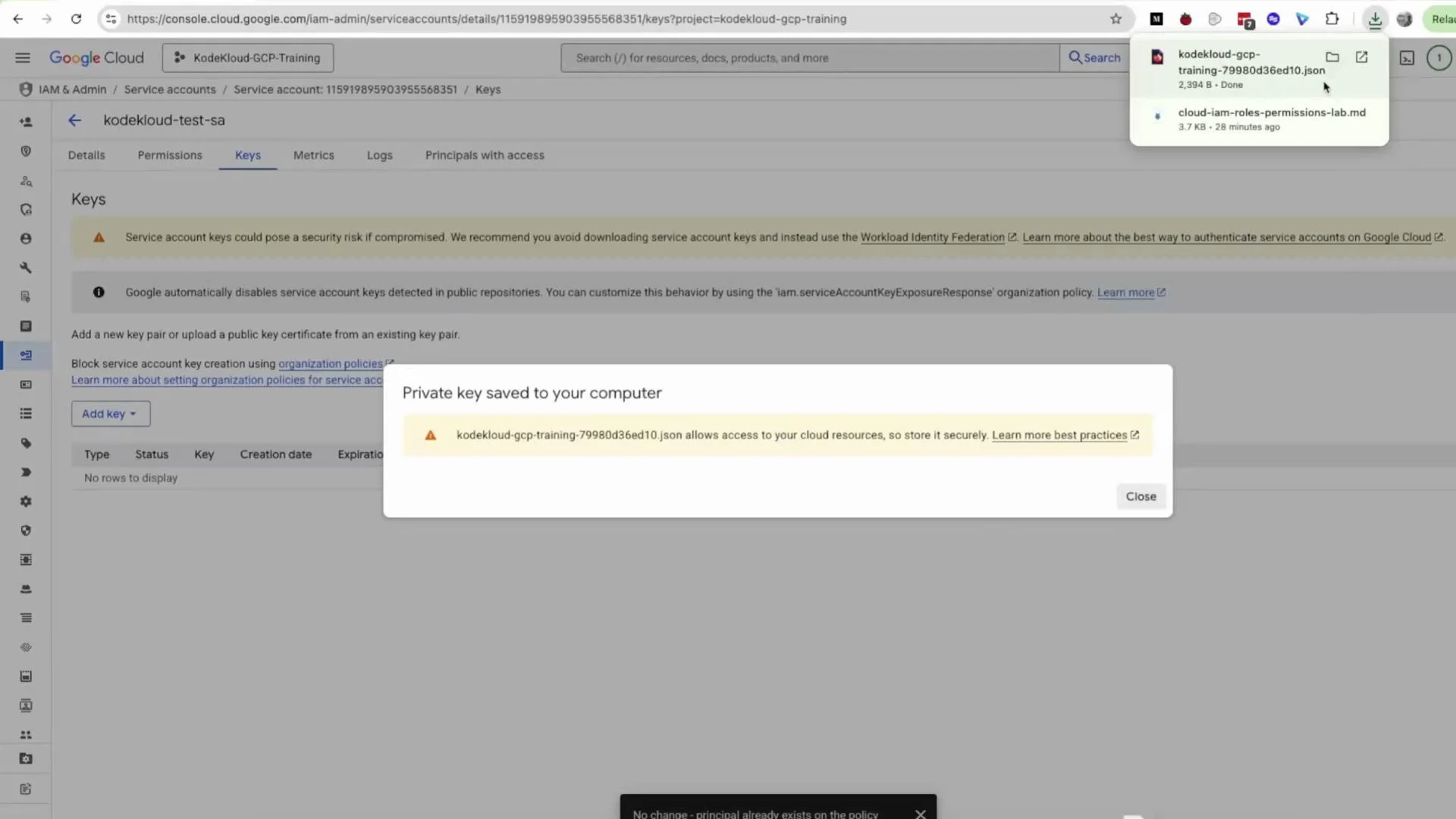A Google Cloud Console screenshot showing the IAM & Admin service accounts keys page with a popup saying "Private key saved to your computer" and a downloaded JSON key file. The page warns about security risks of service account keys and provides options to add keys.