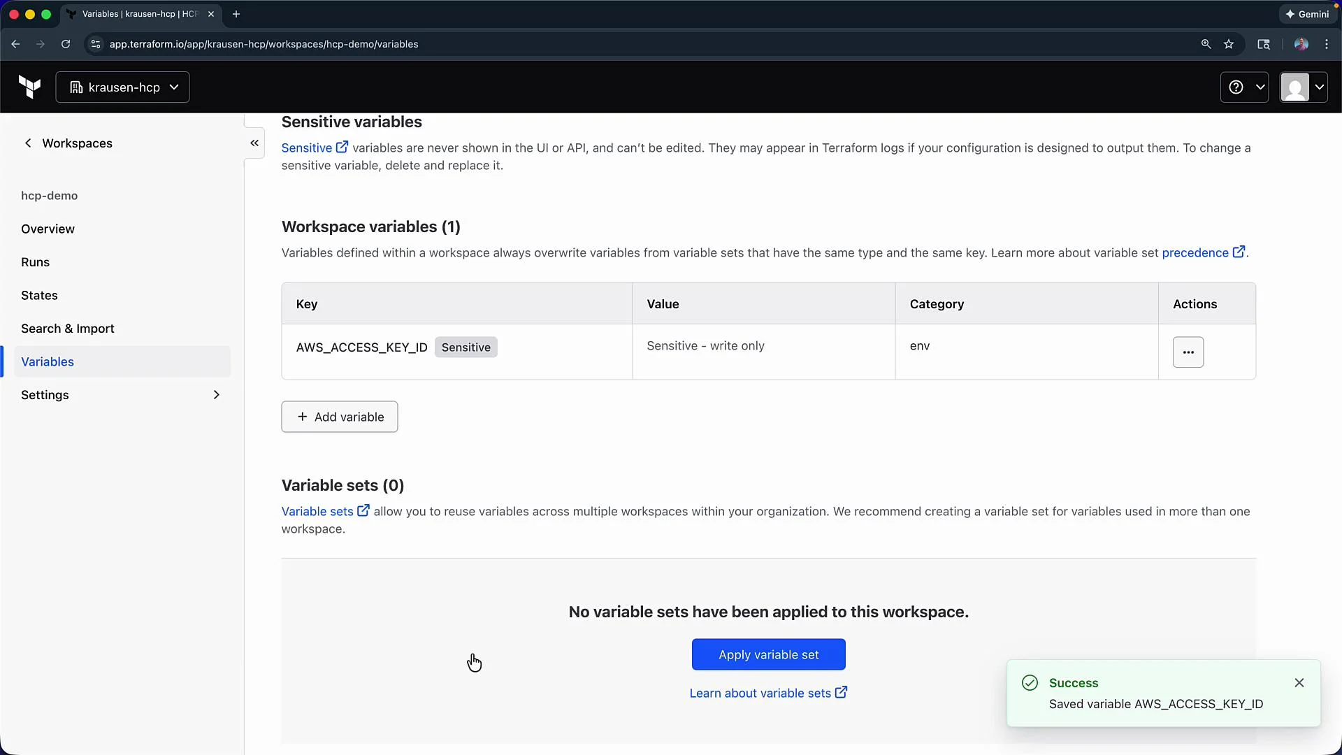 The image shows a Terraform Cloud workspace variables page, displaying a sensitive workspace variable named "AWS_ACCESS_KEY_ID." There's also an indication that a variable was successfully saved.