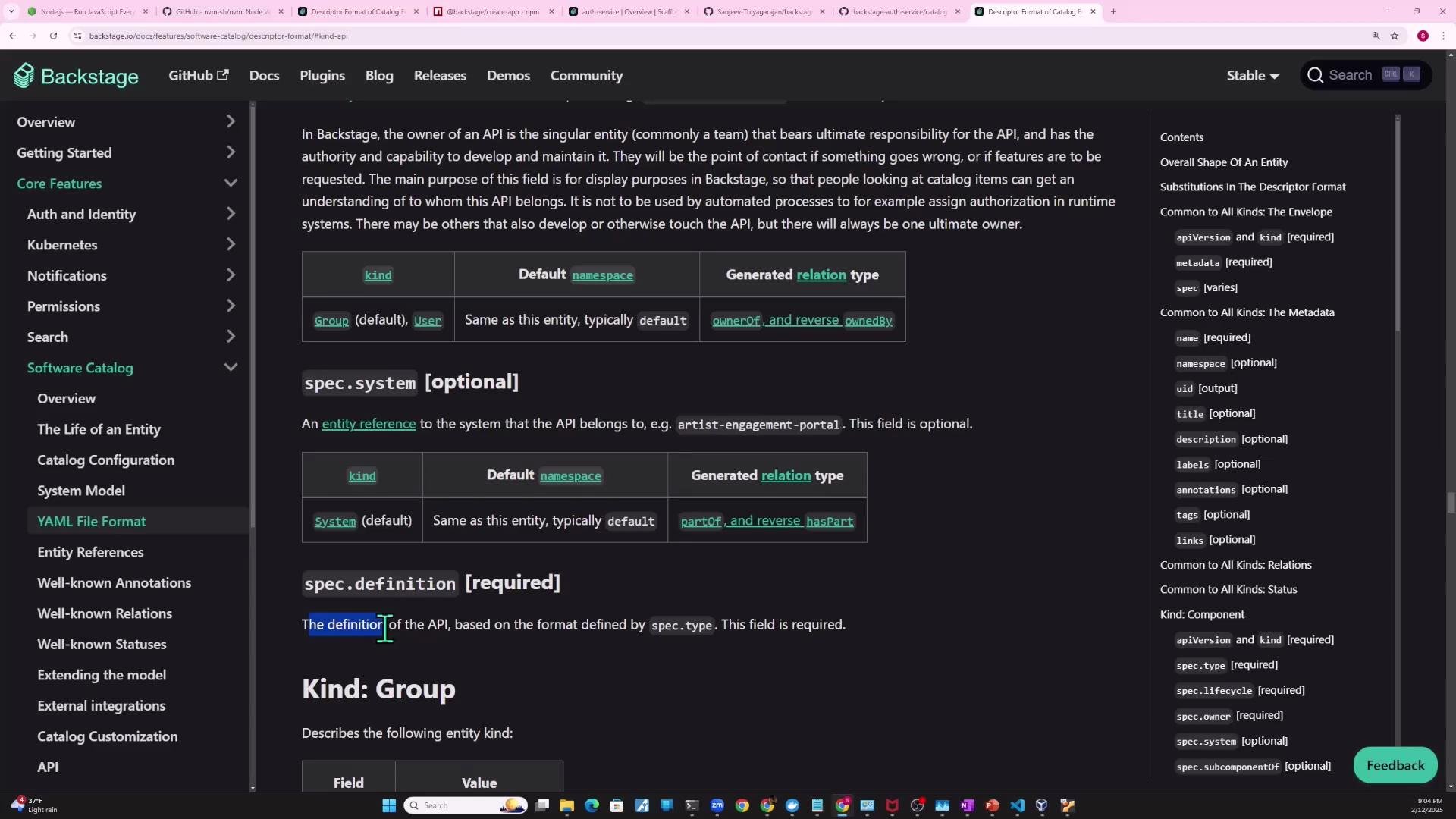 A screenshot of the Backstage documentation page for the Software Catalog YAML file format, showing the left navigation menu, main content describing spec.system/spec.definition and relation tables, and a right-hand table of contents. The browser window has multiple tabs open and the system taskbar is visible at the bottom.