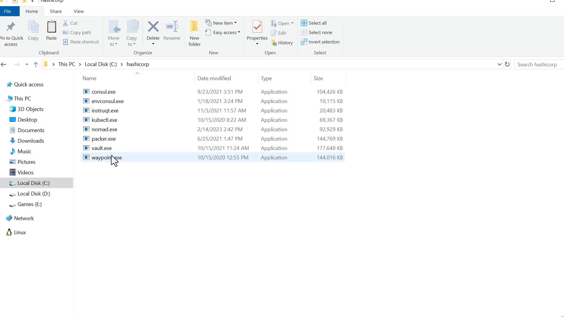 A Windows File Explorer window open to C:\hashicorp showing a list of HashiCorp executables (consul.exe, vault.exe, nomad.exe, packer.exe, waypoint.exe, etc.) with sizes and modified dates. The waypoint.exe file is highlighted.