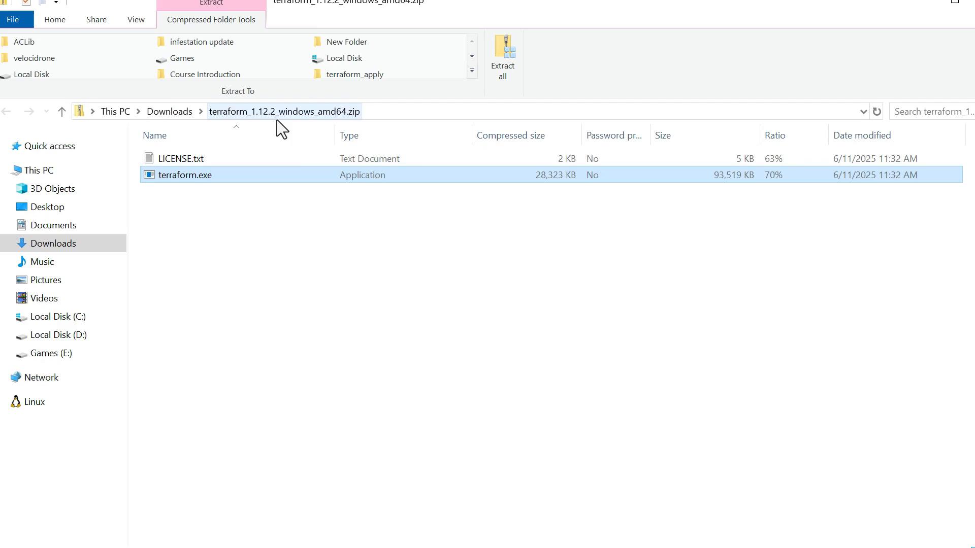 A Windows File Explorer window showing the contents of a downloaded zip file (terraform_1.12.2_windows_amd64.zip) with LICENSE.txt and terraform.exe listed, the terraform.exe entry highlighted. The left pane shows the Downloads folder selected.